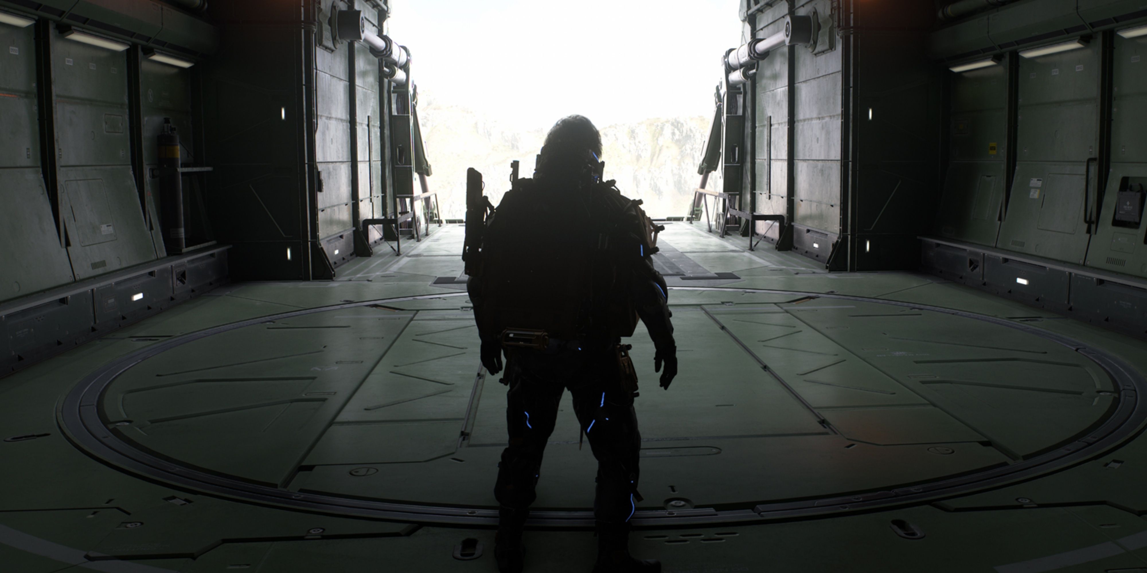 sam bridges with his back to the camera looking through a door way in death stranding 2.