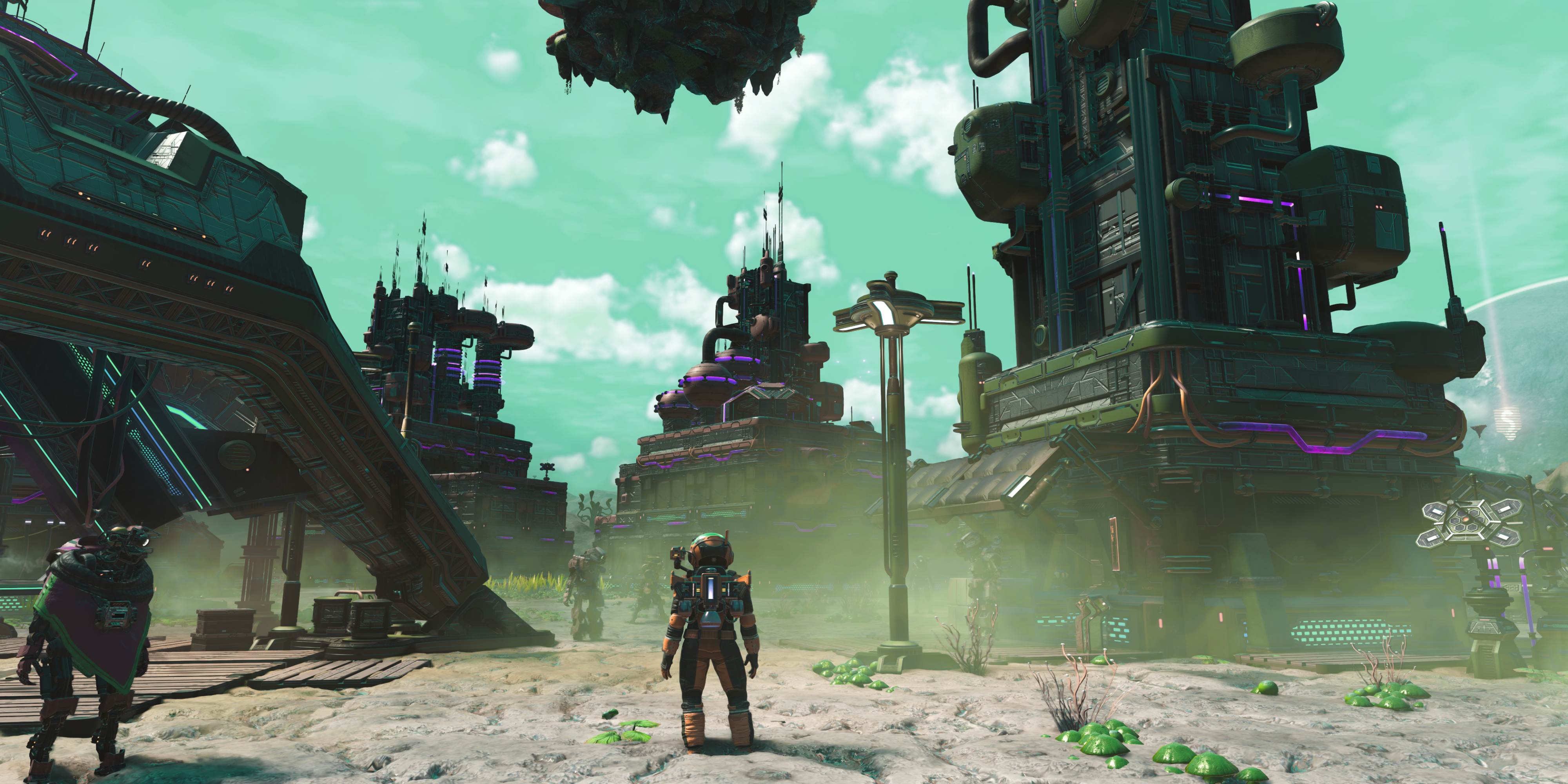 no mans sky character standing in a large settlement.