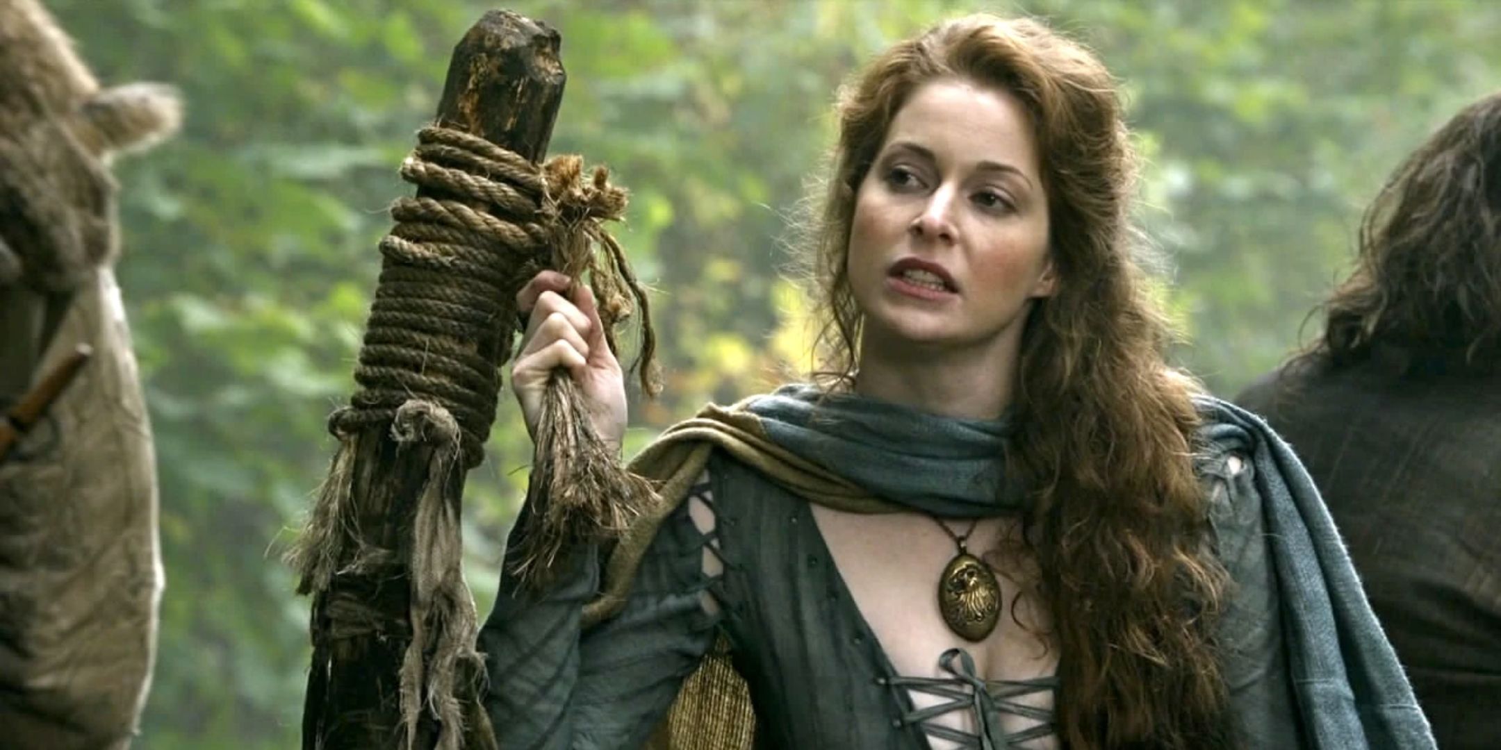 Ros holding onto a rope in Game of Thrones.