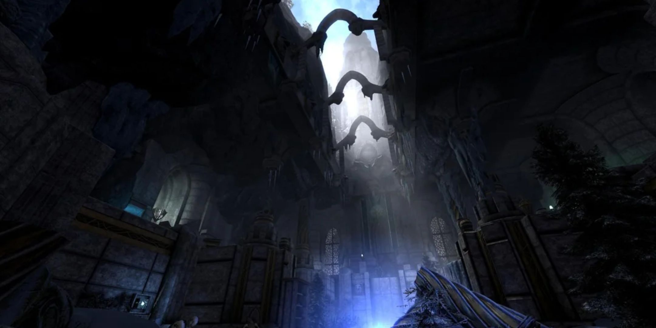 A screenshot of Skyblivion, showing the inside of a building with the light from outside pouring through a gap in the ceiling. 