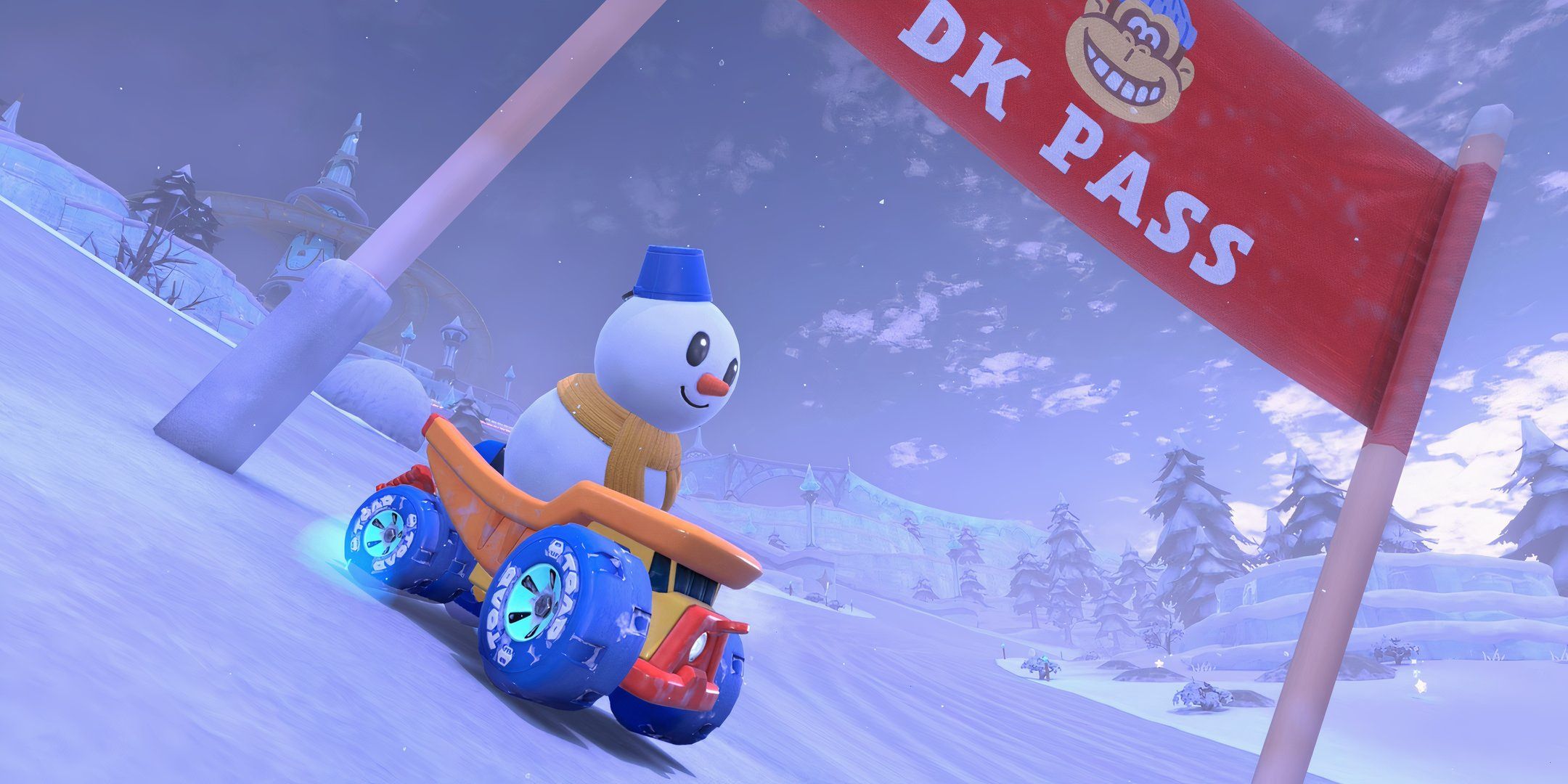 Snowman drives under a red banner on DK Pass in Mario Kart World.