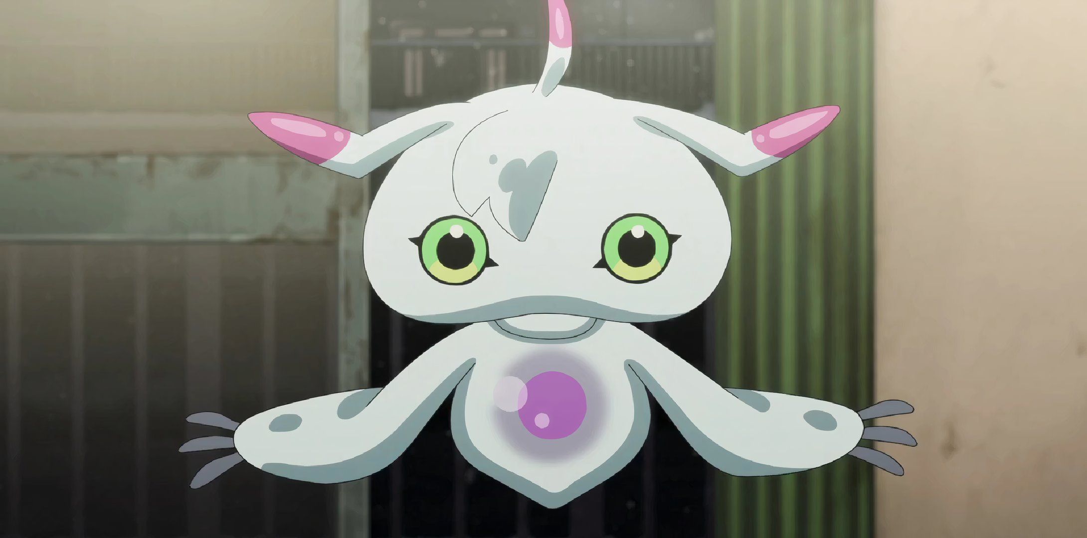 Ukkomon from Digimon facing straight into the camera.