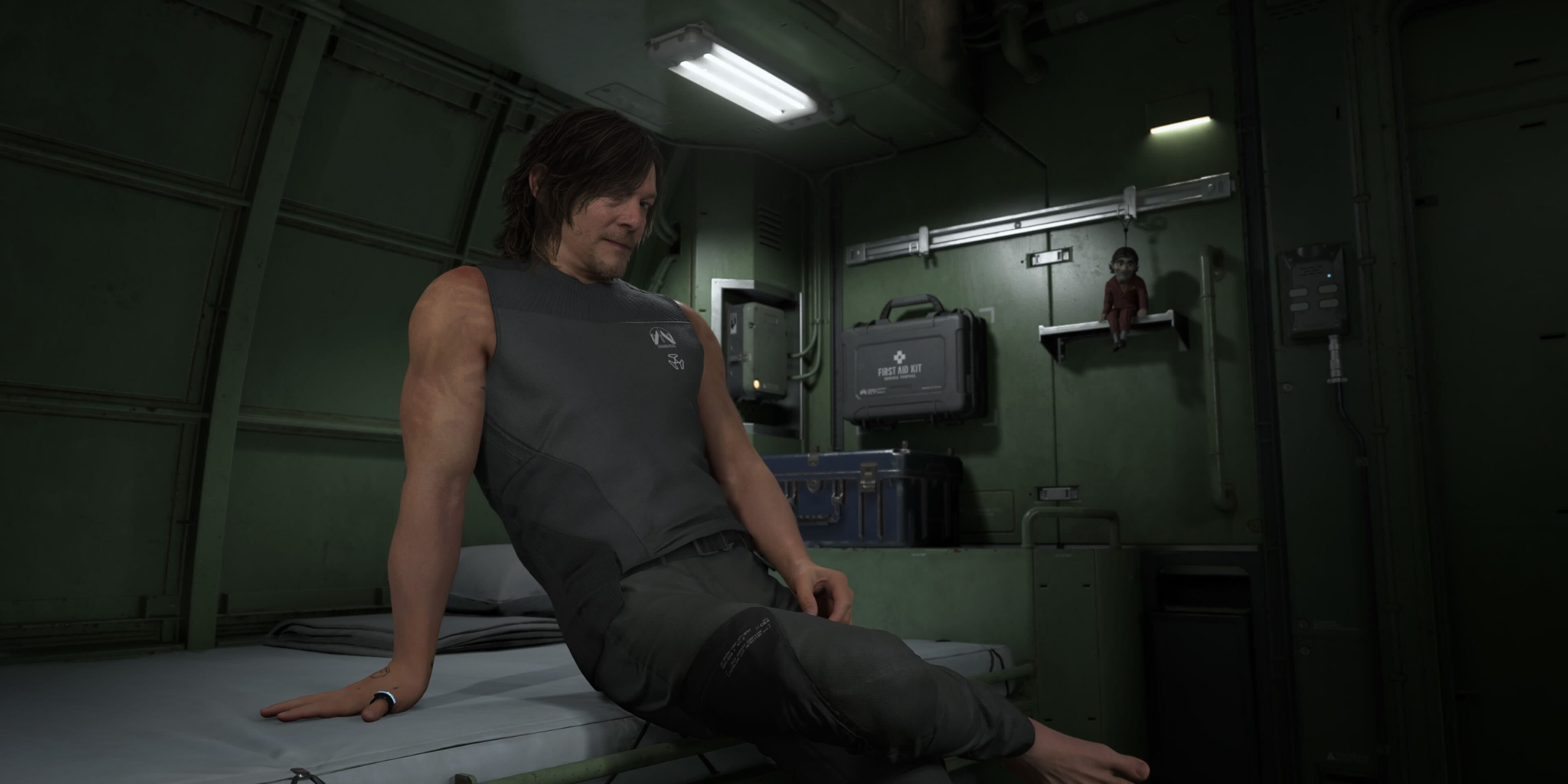 Sam Porter Bridges makes a cheeky pose in his private room in Death Stranding 2. 
