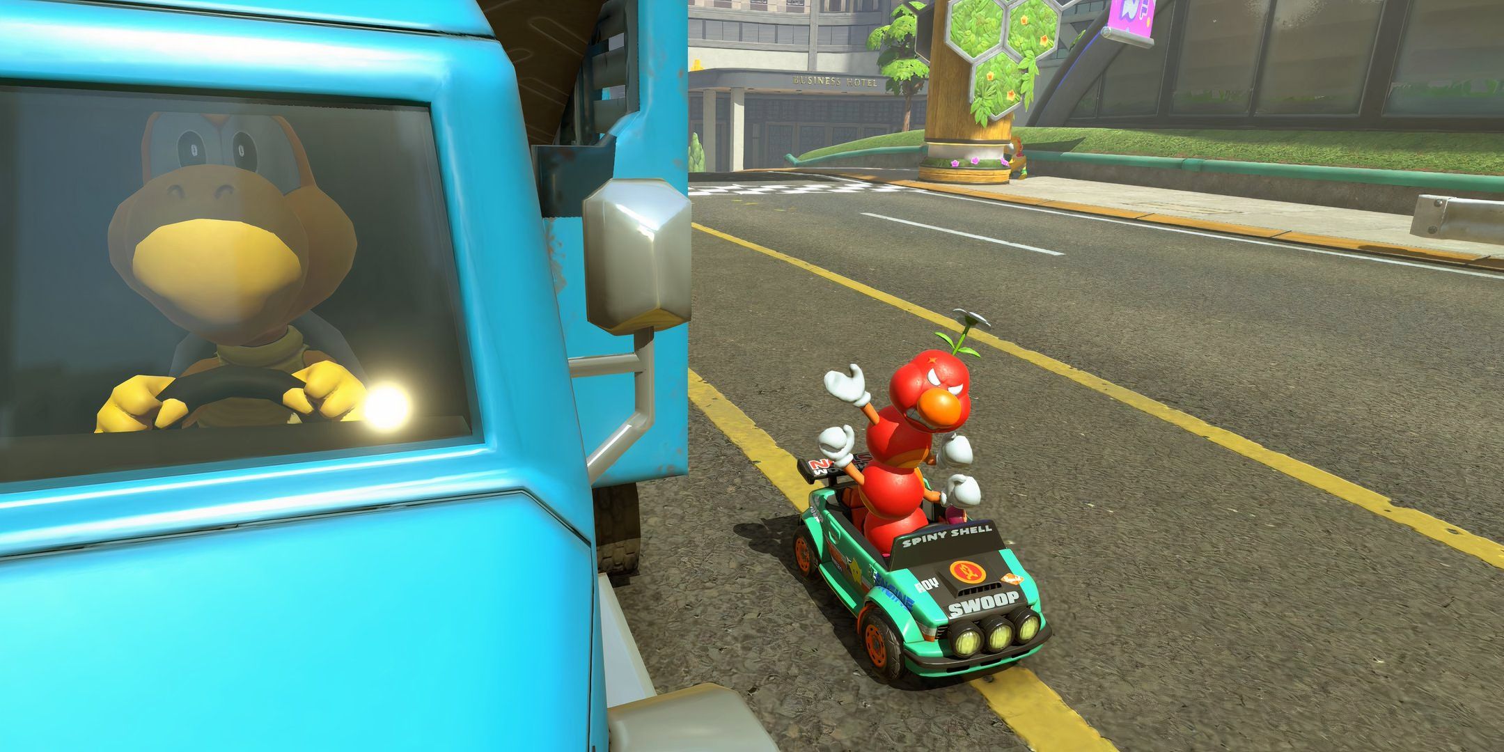 Wiggler angrily raises its fist at a Koopa Troopa in Mario Kart World.