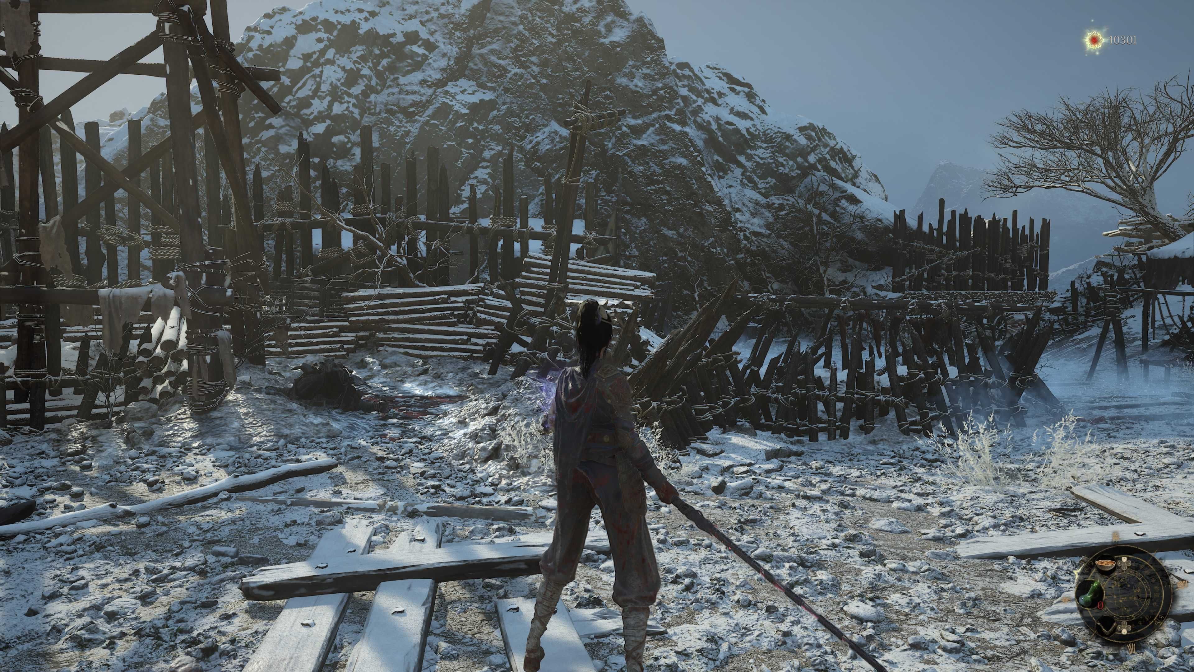 A woman with a sword stood in an open snowy clearing.