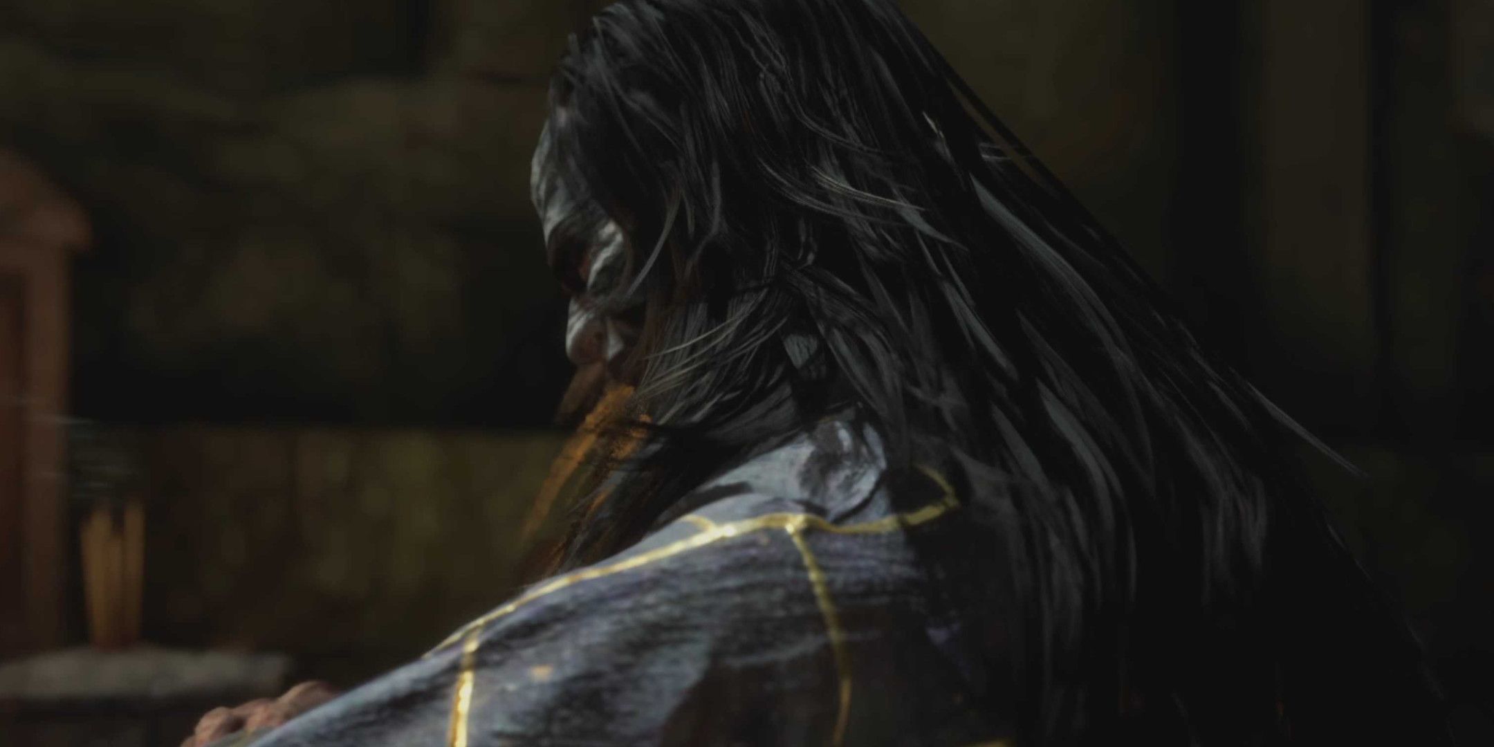 A long haired man with his back to camera, looking over his shoulder.