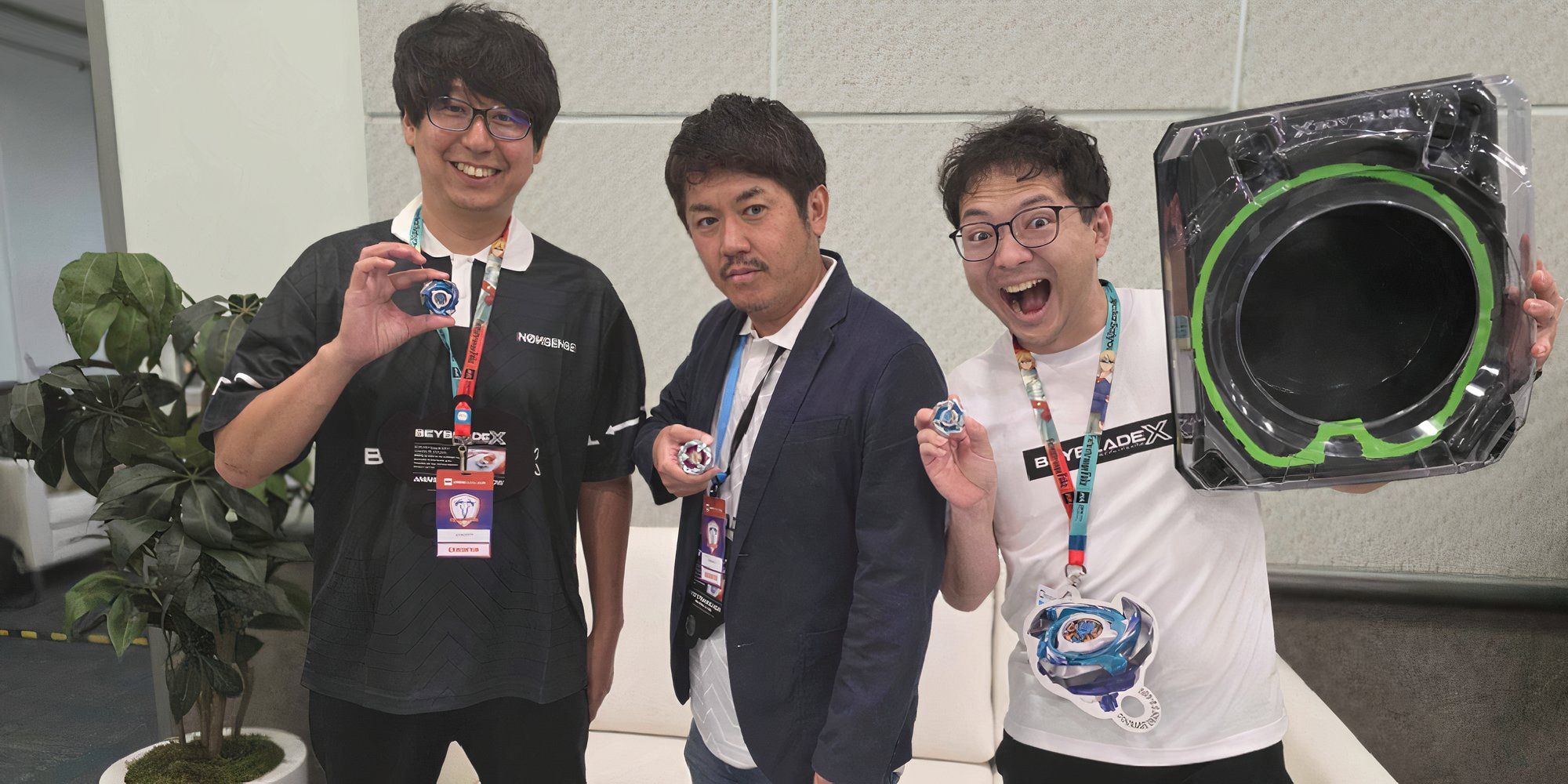 Beyblade Takara Tomy Executives Holding Beyblades And Smiling.