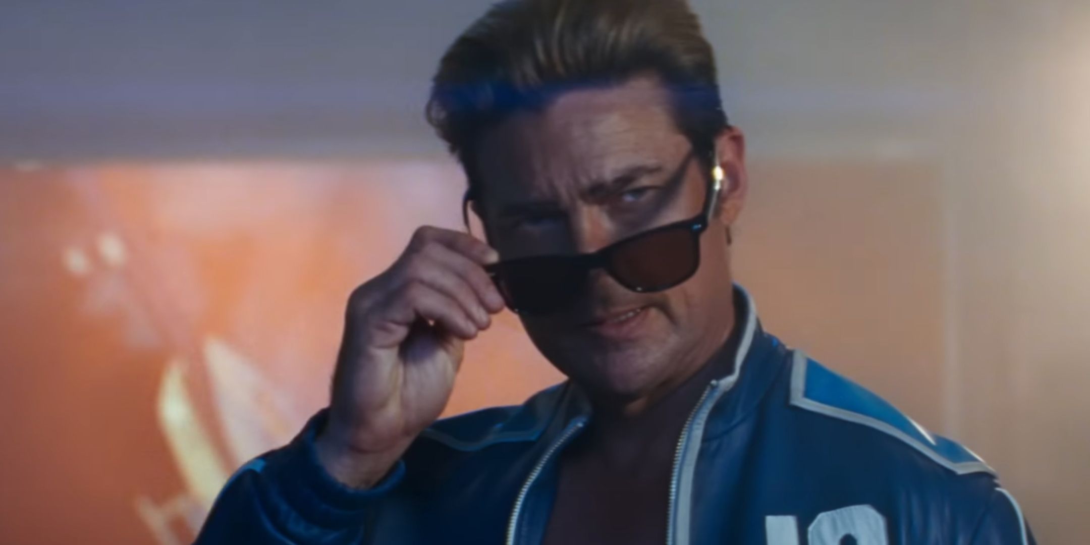 Karl Urban as Johnny Cage pulling down his sunglasses.