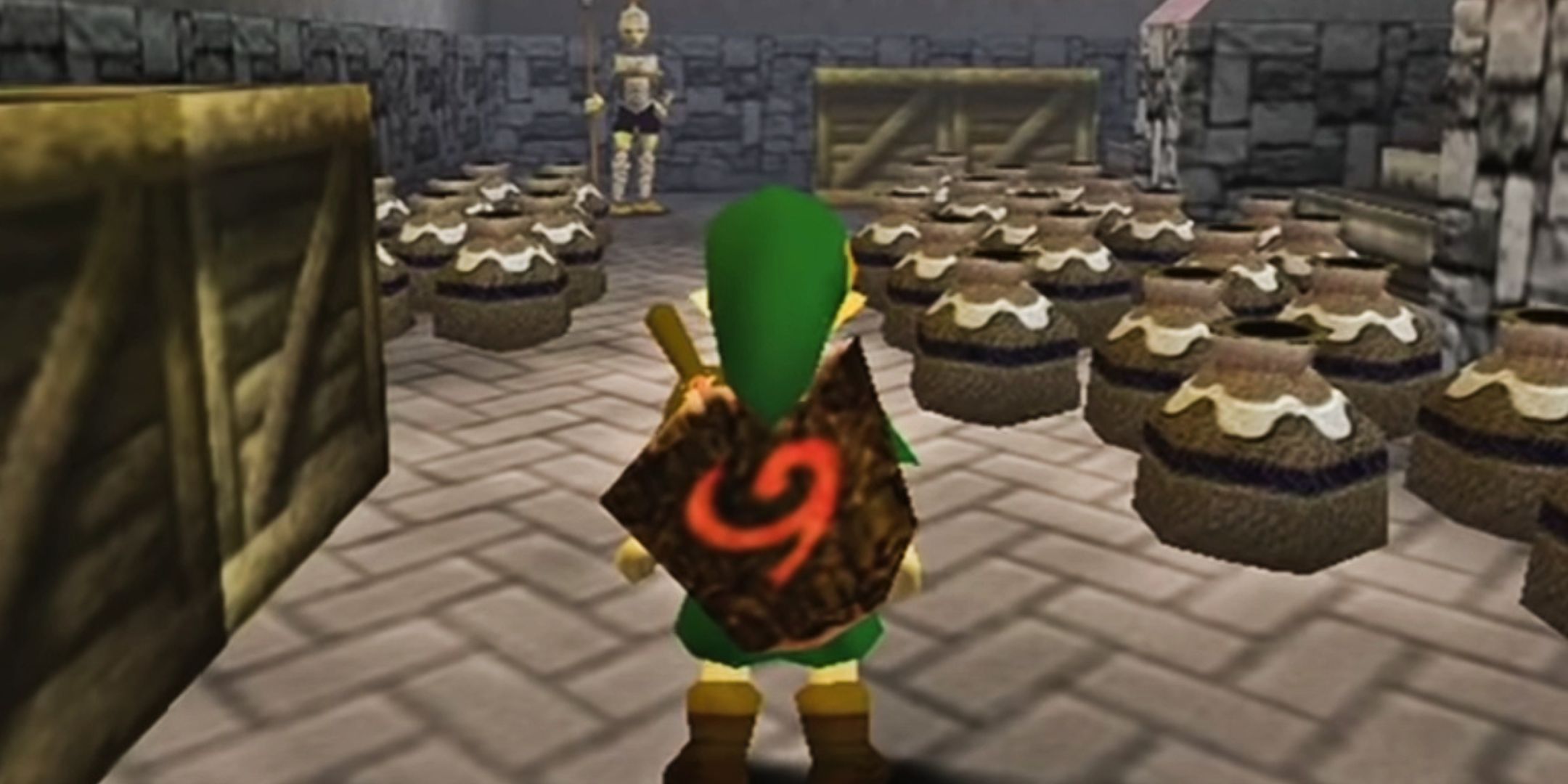 Link standing in a room of pots in The Legend of Zelda Ocarina of Time.