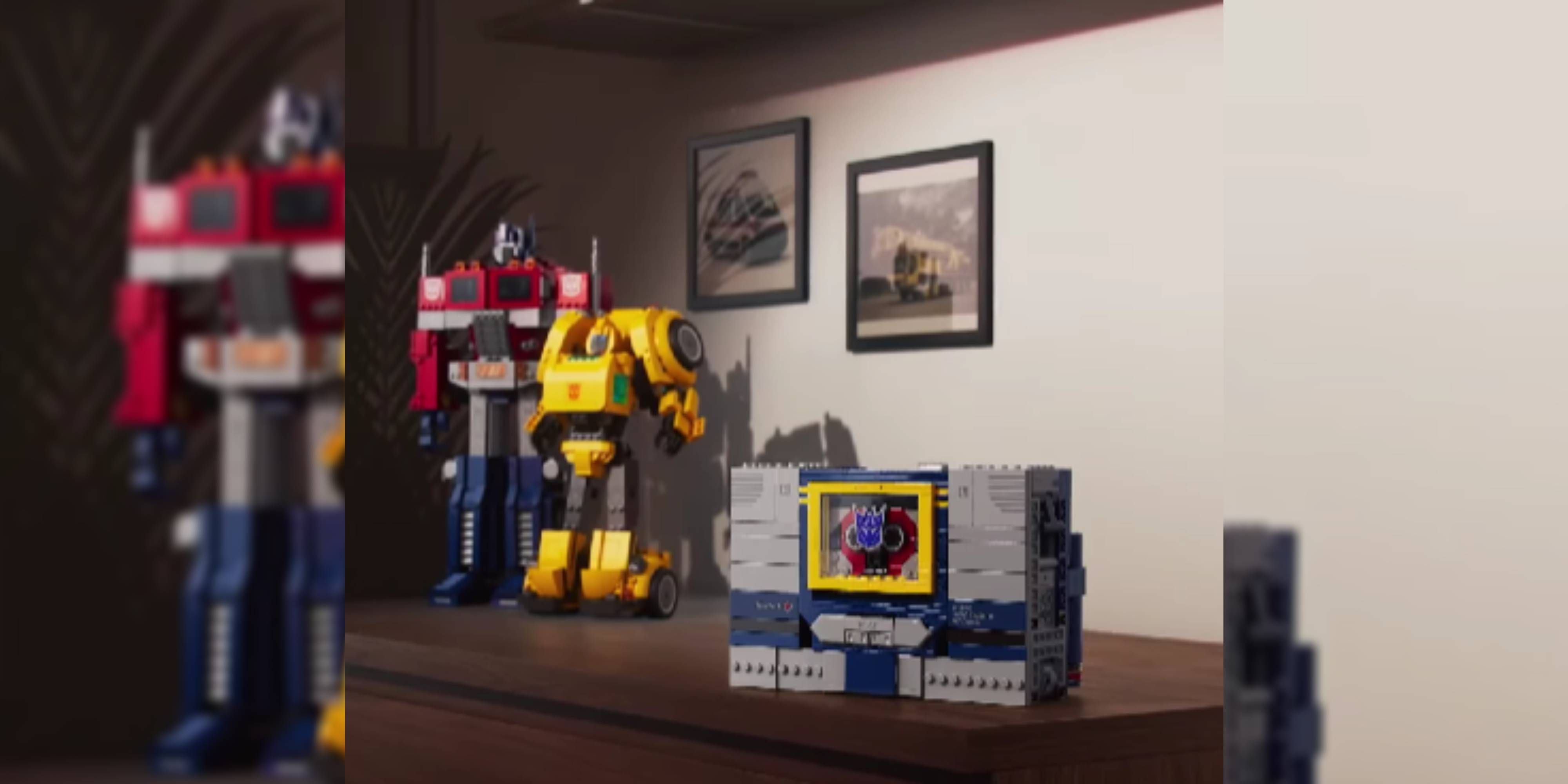 optimus prime and bumblebee lego sets next to soundwave's deck.