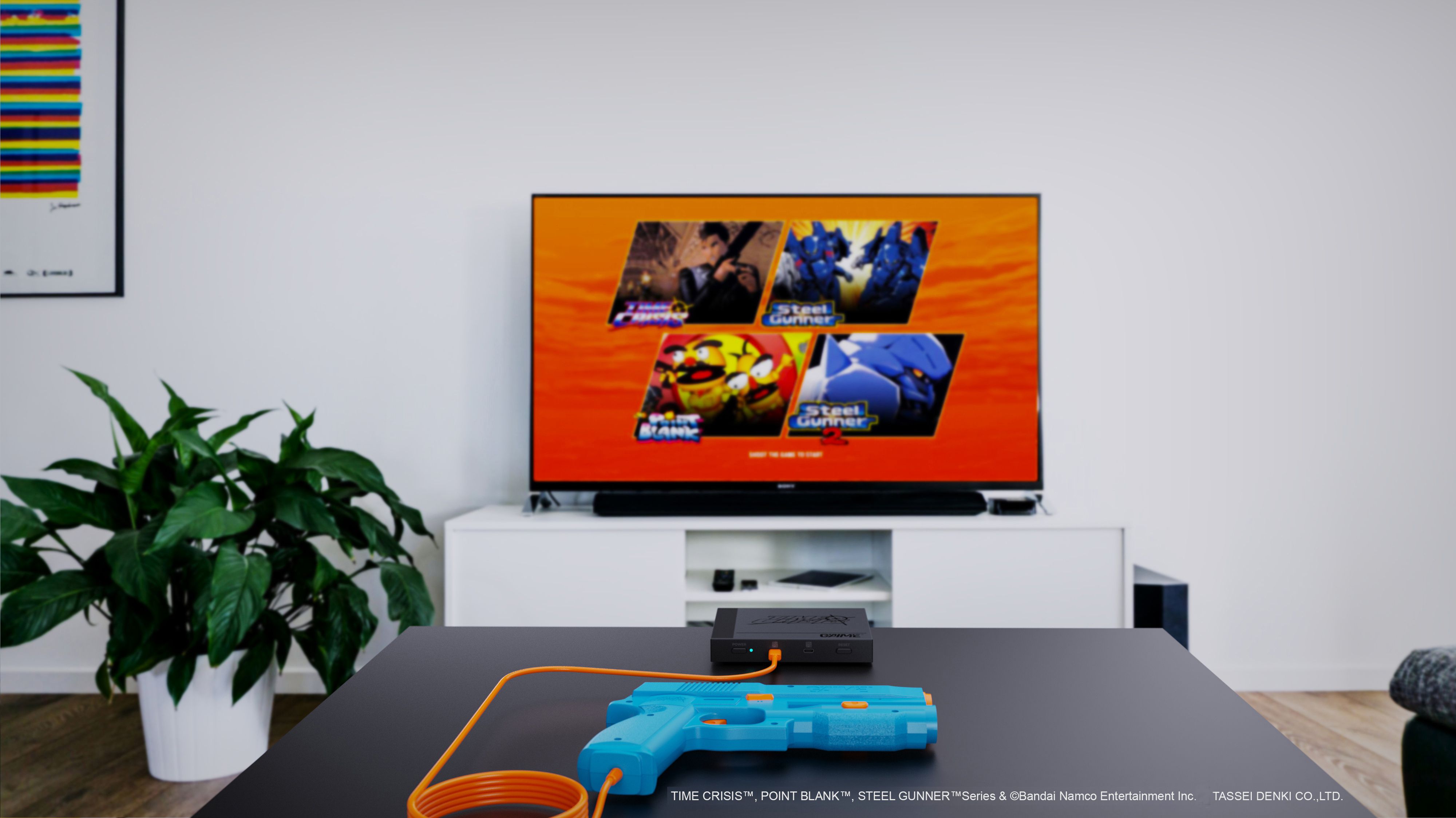 The Gaime Plug and Play gun in front of a screen.