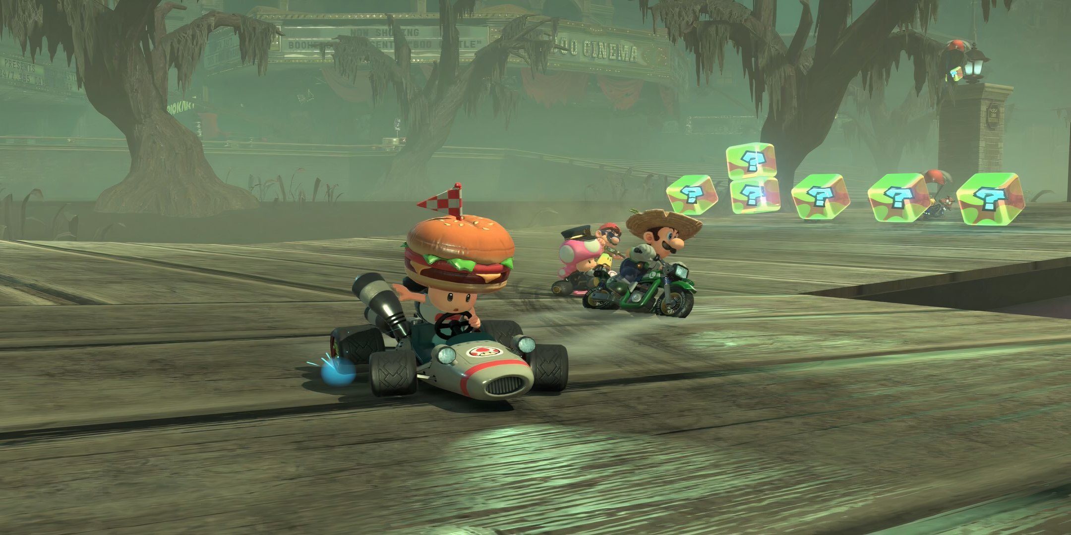 toad drifting around a corner with luigi, toadette and mario in the background in boos cinema in mario kart world.