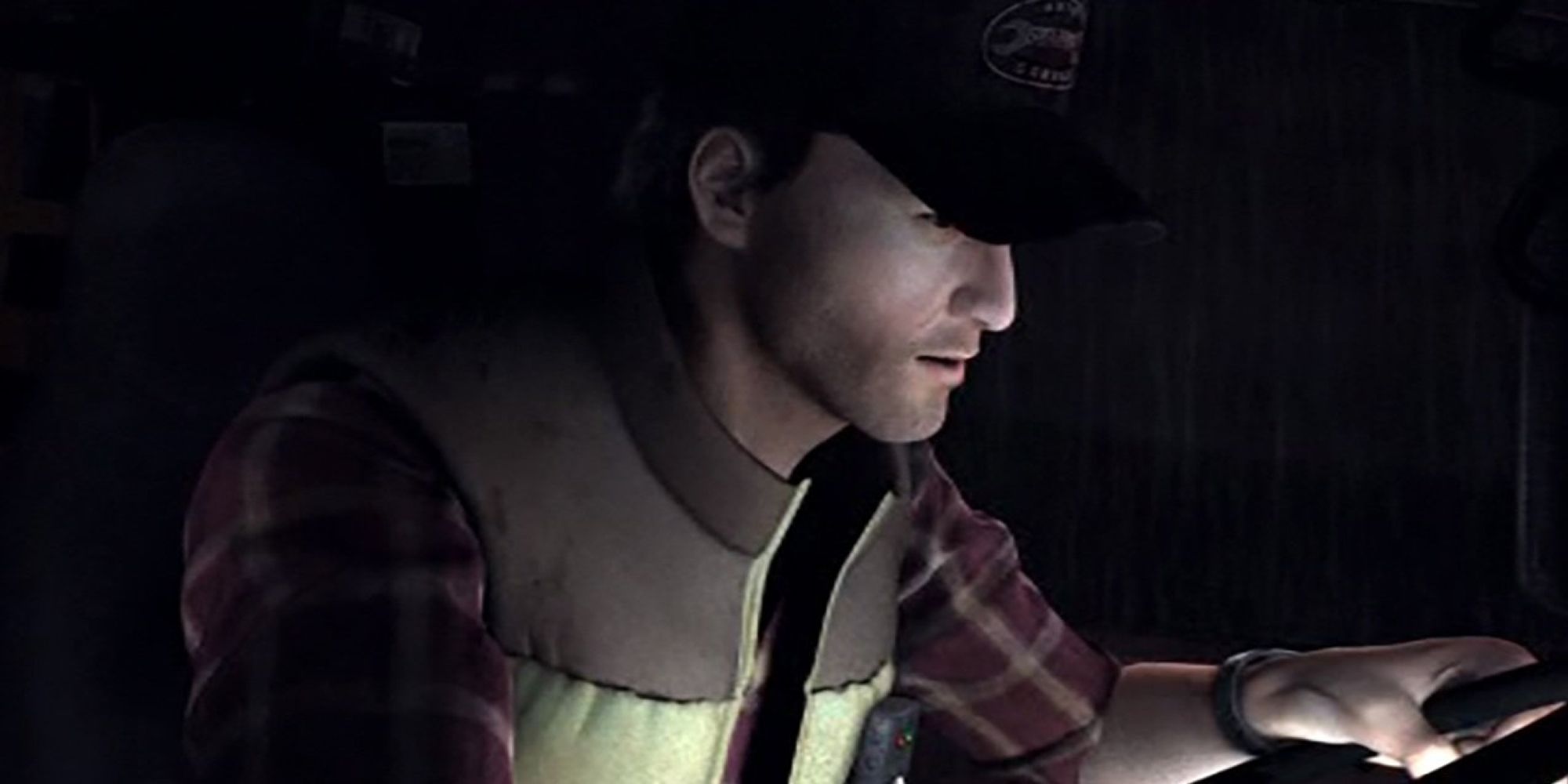 Travis Grady examines something in Silent Hill Origins.