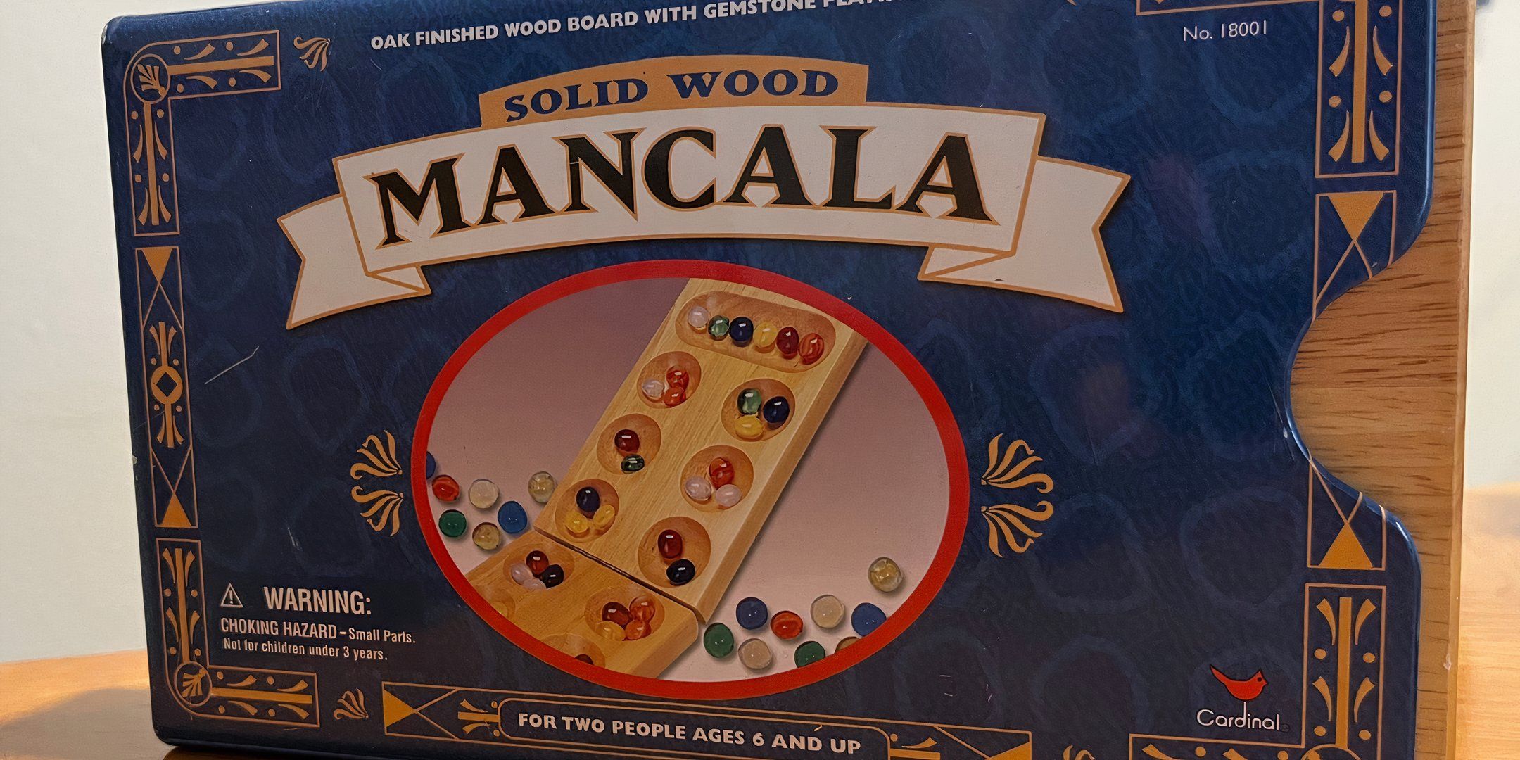 The box art for the board game Mancala. 