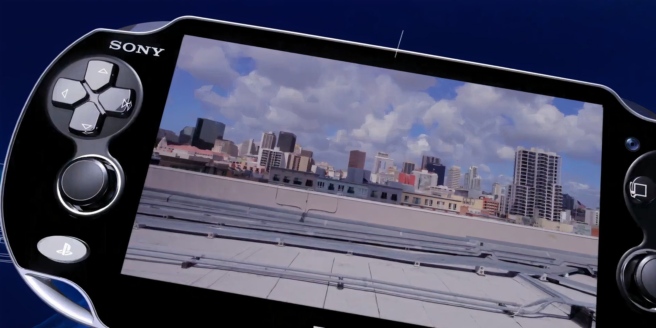 PS Vita console displaying a cityscape from a game.