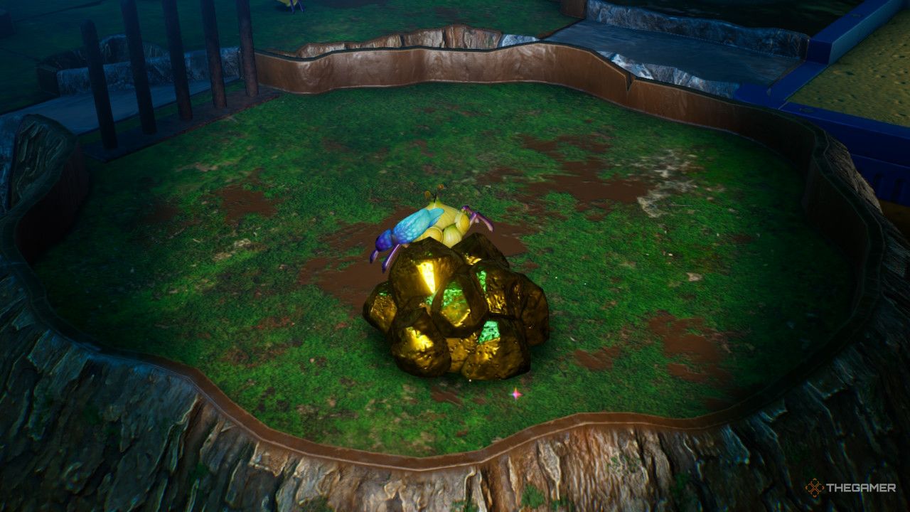 a pile of gold nuggets near a crab in pikmin 4