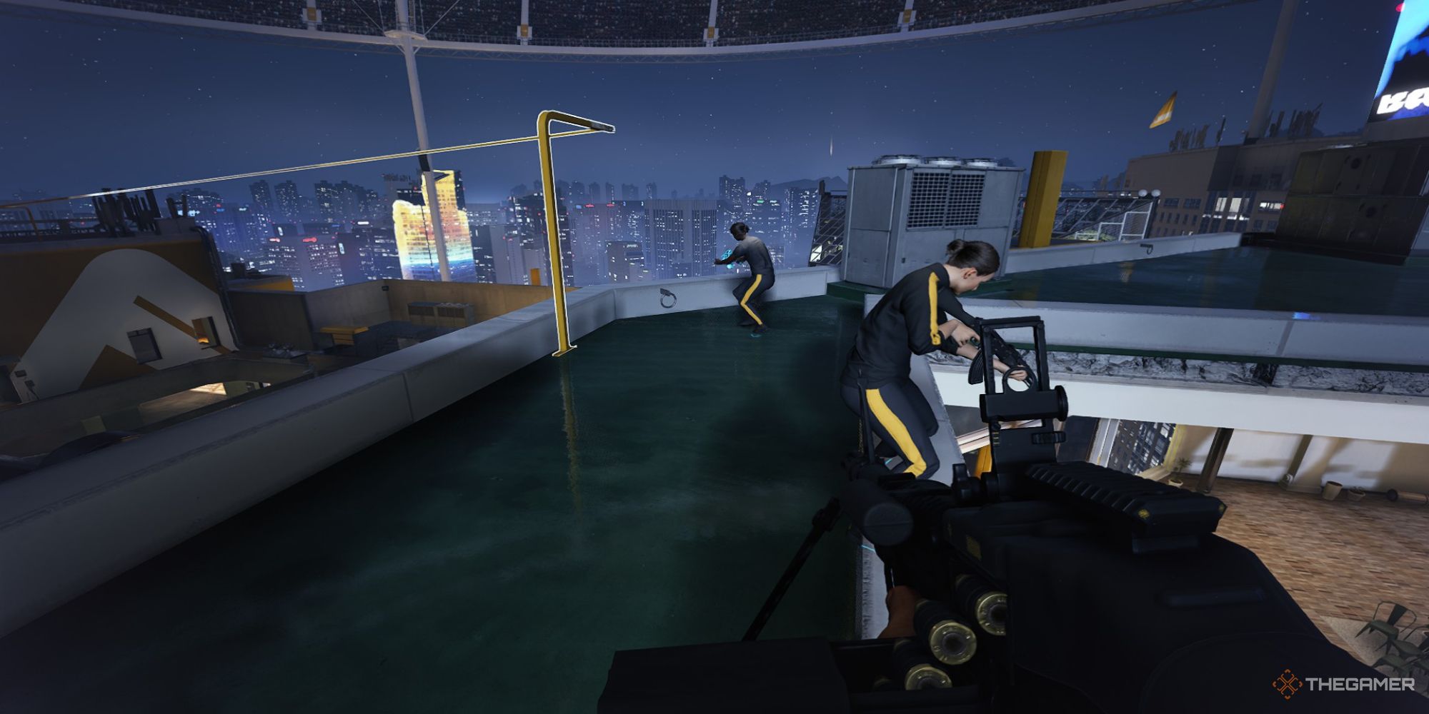 A screenshot from The Finals showing a team of three guarding the roof of a tall building