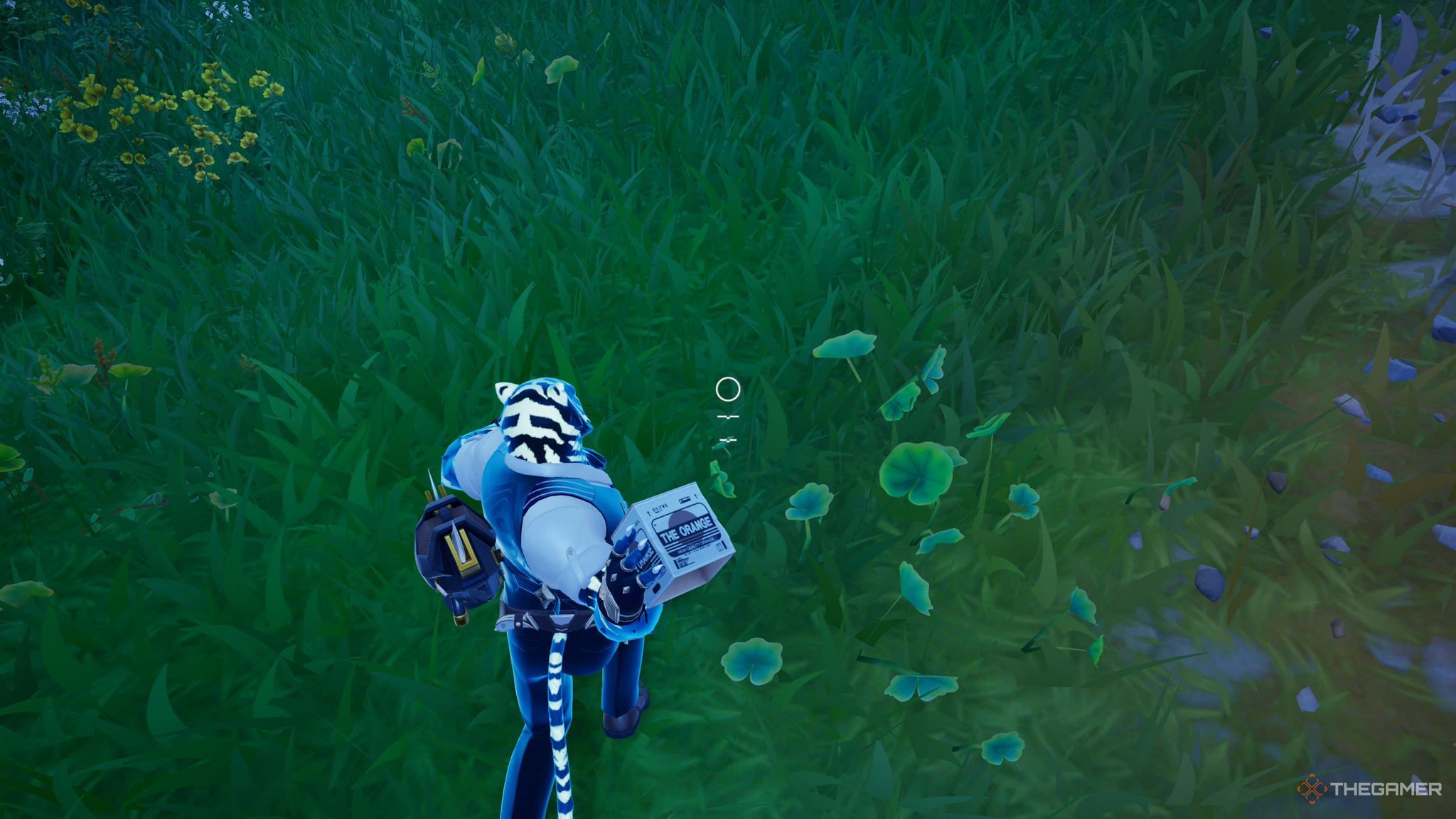 A screenshot from Fortnite showing the player character as a white and black tiger in a suit getting ready to throw the box on the grass under them.