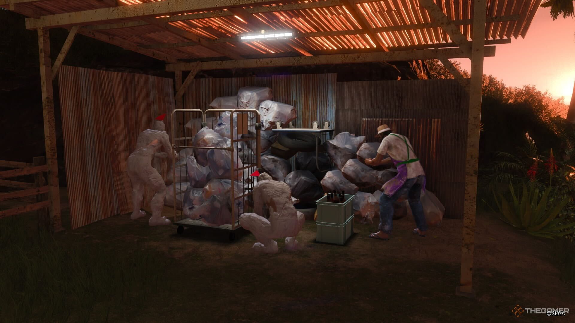 A screenshot from Like a Dragon: Infinite Wealth showing two sand Sujimon and another in an apron digging through trash under a canopy as the sun sets in the distance.