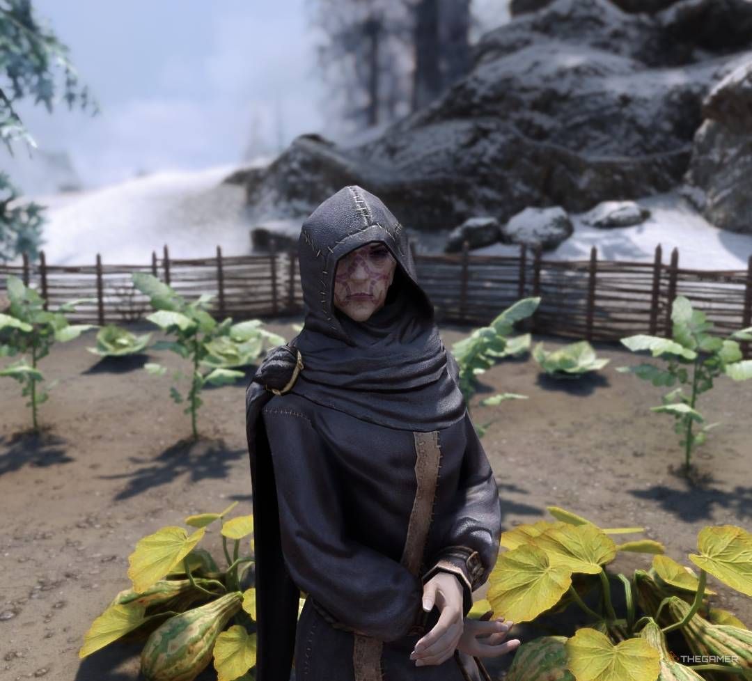 Dravynea the Stoneweaver stands with hands crossed at farm in Kynesgrove, Skyrim.