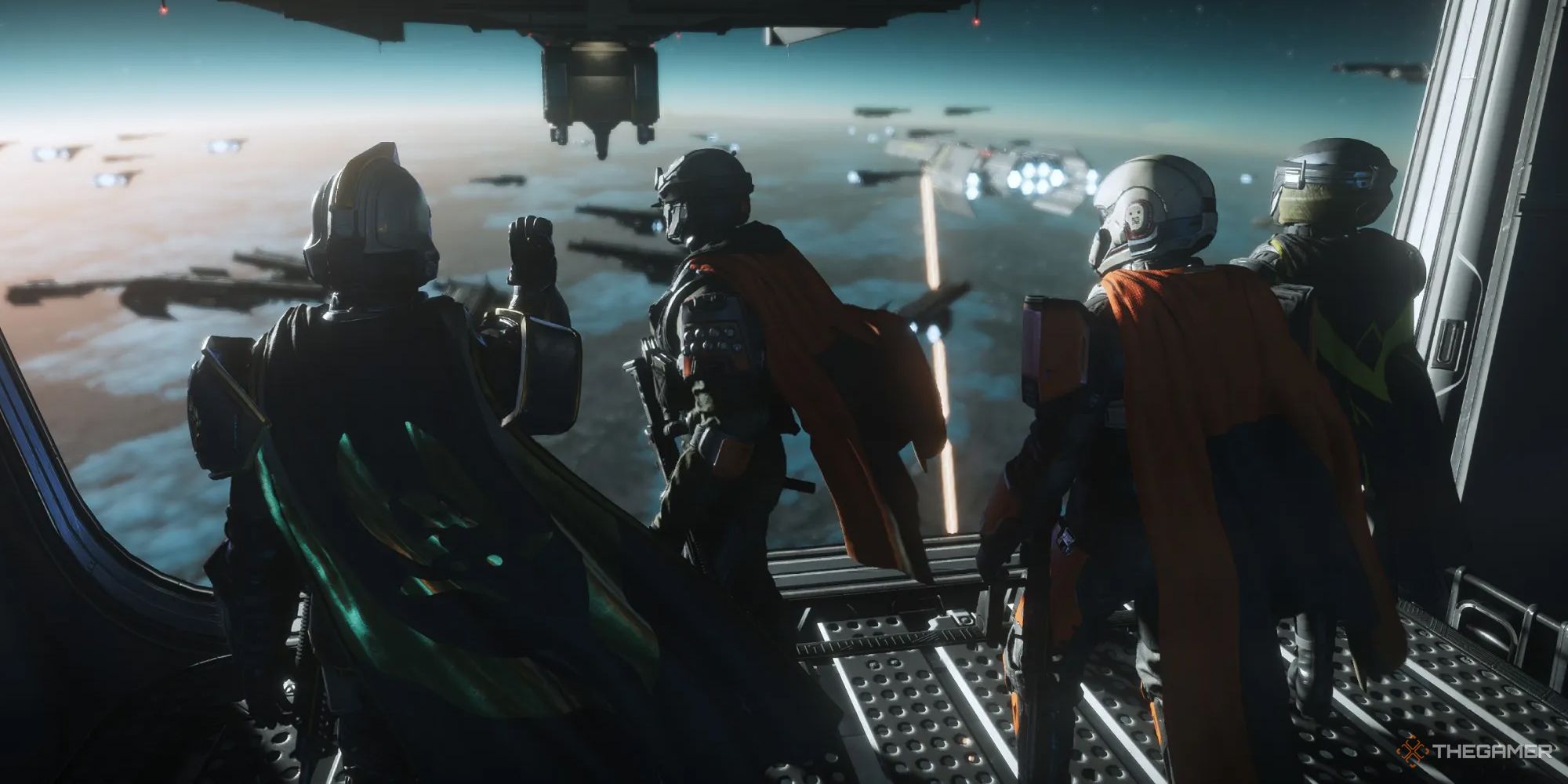 Four Helldivers 2 players standing at the bridge fo the ship, looking out at the fleet in orbit