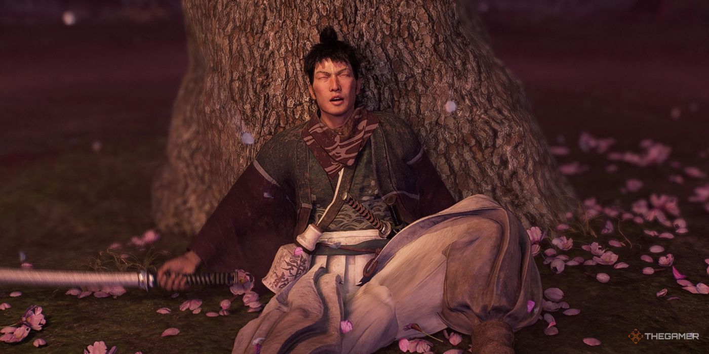 Kogoro Katsura lies under a tree outside the Miyozaki Pleasure District after getting knocked down by the protagonist in Rise Of The Ronin.