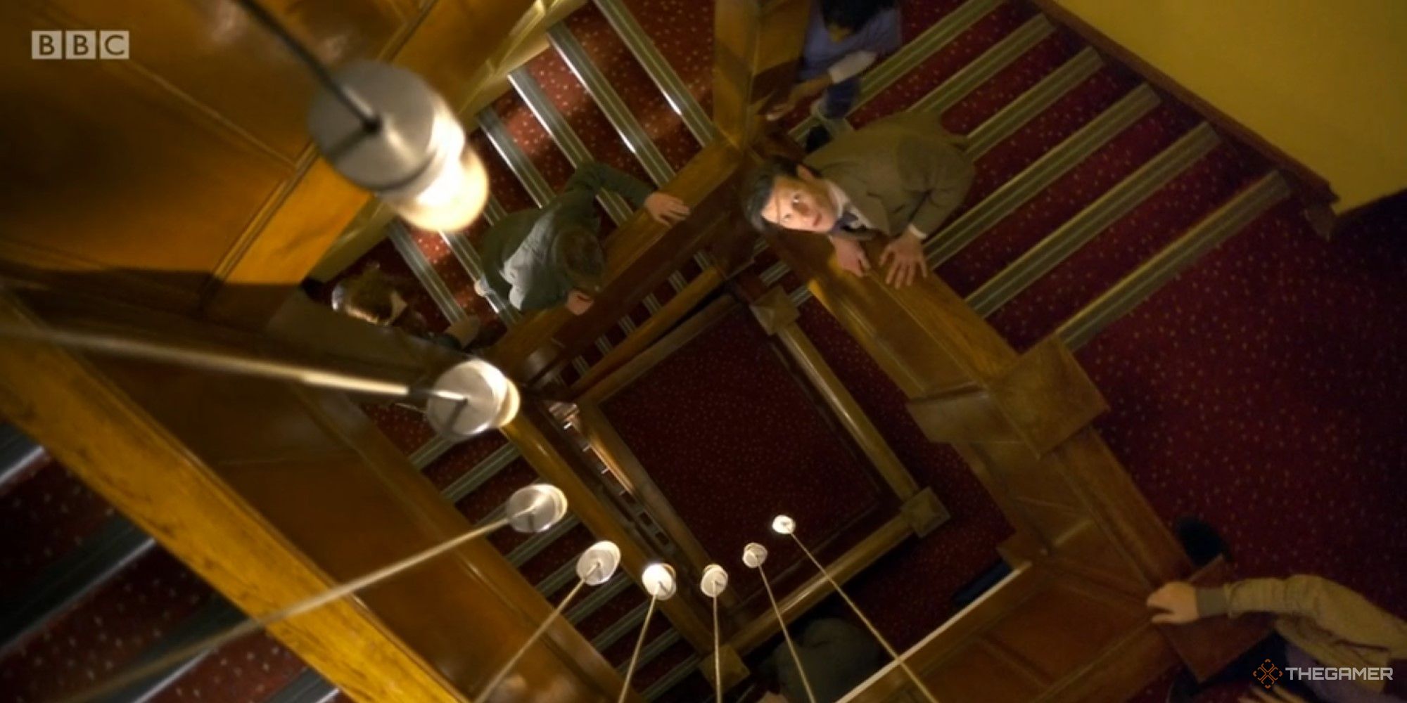 An image of the Doctor and friends ascending a staircase from the Doctor Who episode The God Complex