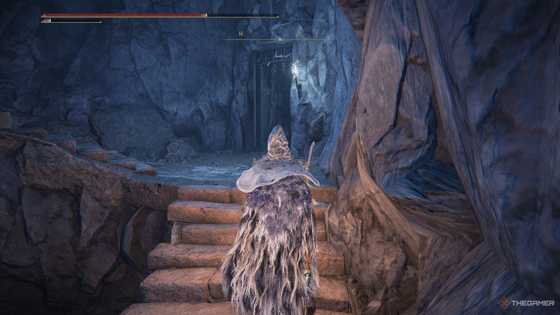 Player stands on stairs of Lamenter's Gaol to consider using the right door in Elden Ring: Shadow of the Erdtree.