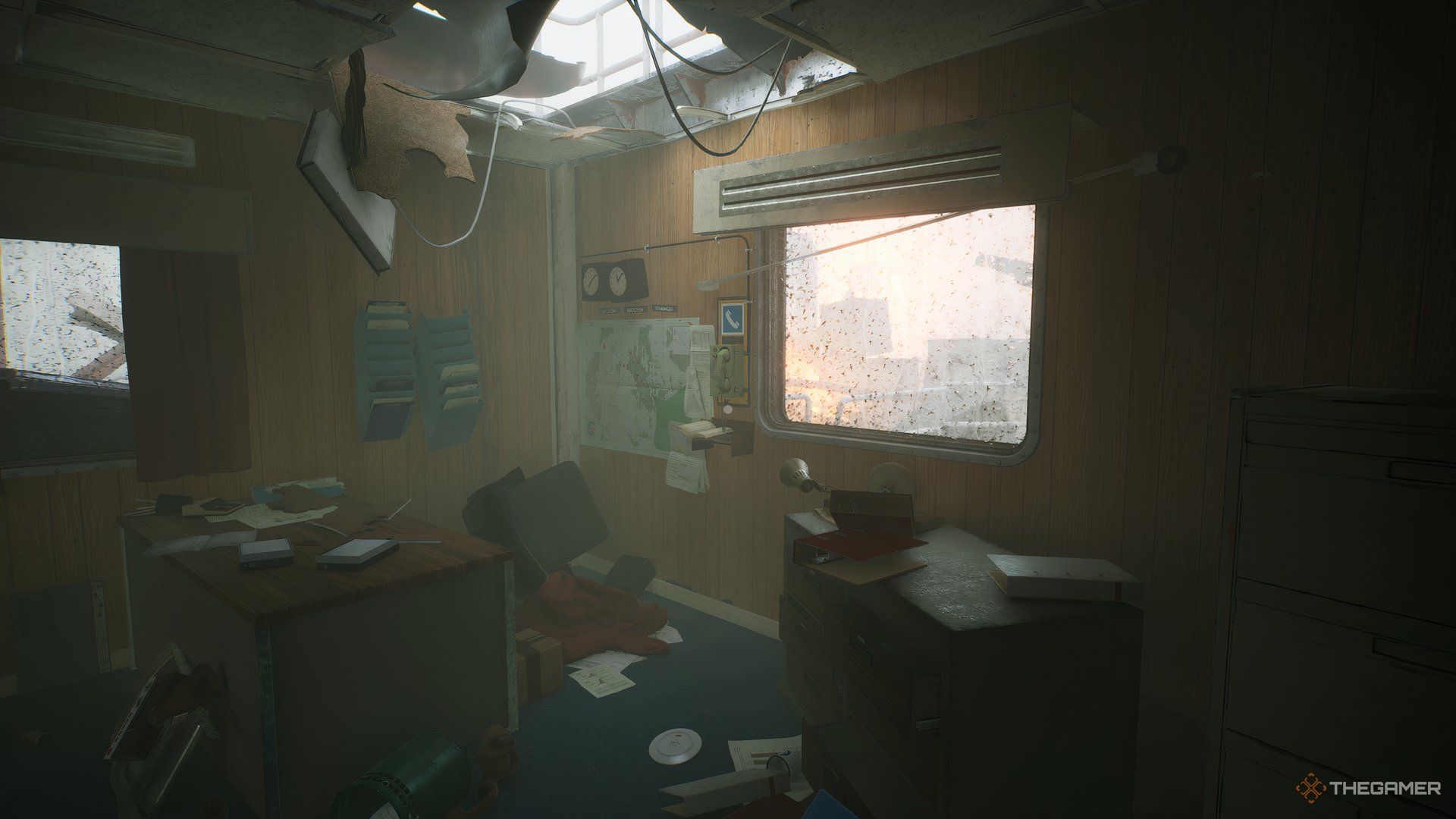 Phone on the back wall of Rennick's office, window on the right, map and world clocks on the left, in Still Wakes The Deep.