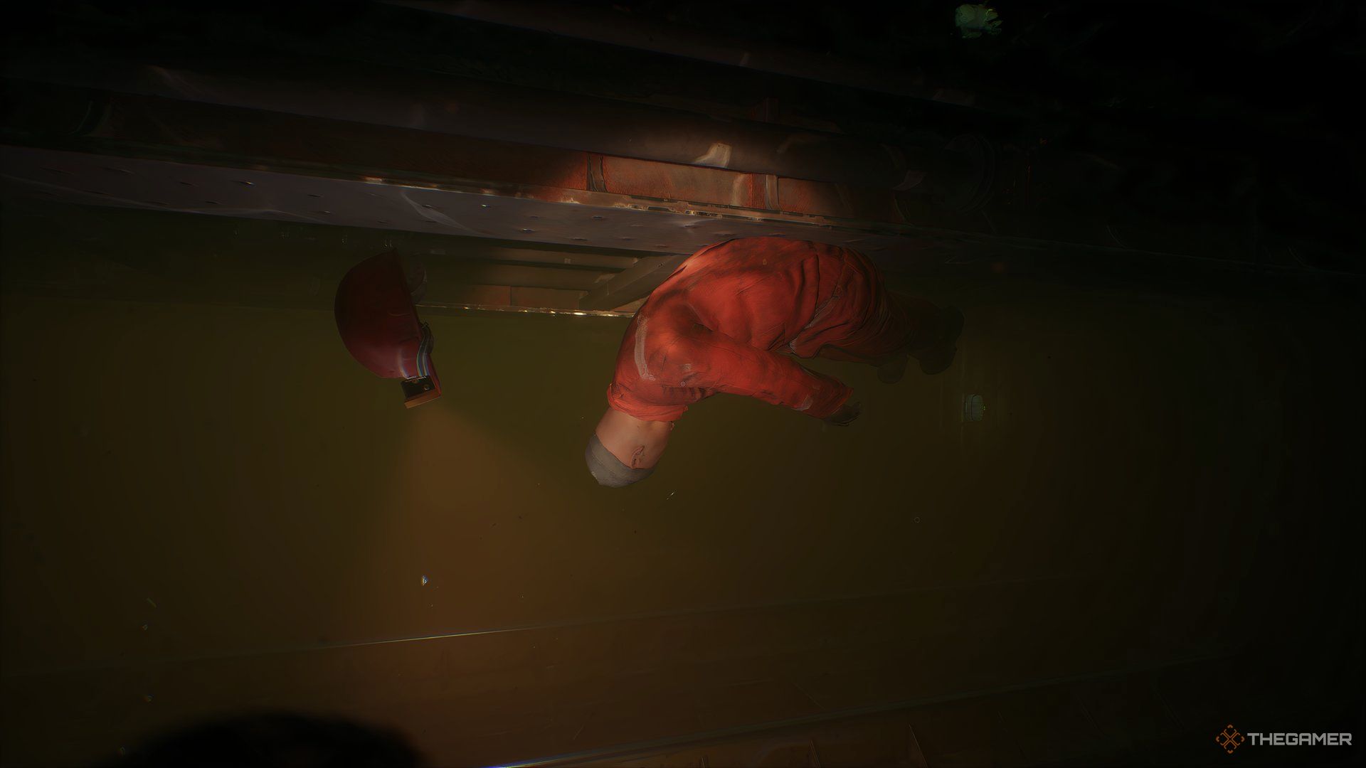 Dead crew member under water in Still Wakes The Deep.