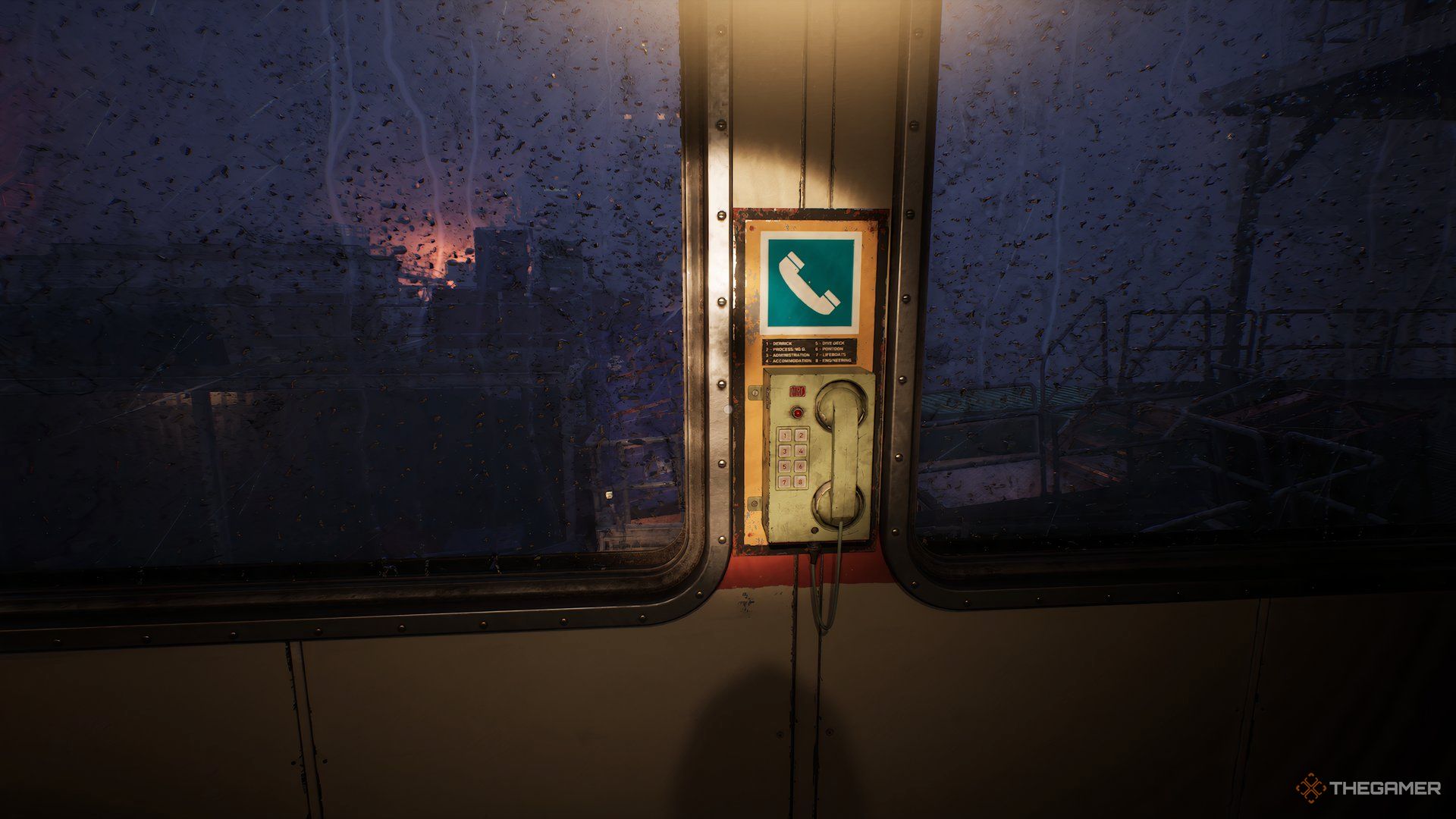 Phone on the wall sandwiched between two windows, rain on the windows looking out at the darkness in Still Wakes The Deep.