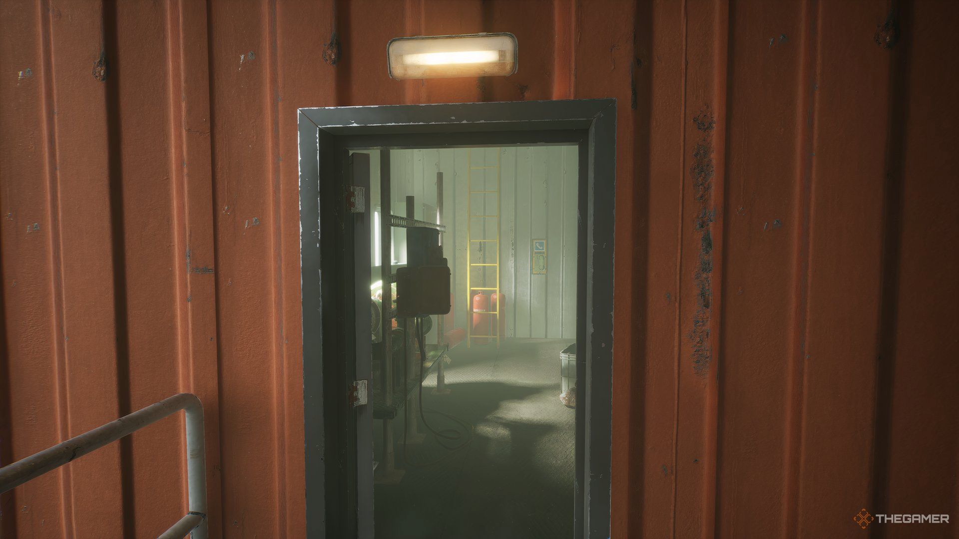 Looking through doorway, yellow ladder at the back of room on the left, the phone is to the right of the ladder in Still Wakes The Deep.
