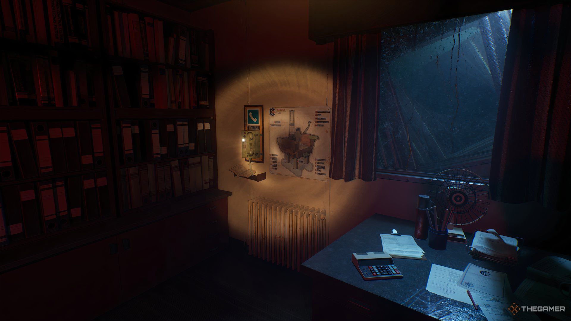 Office with desk to the right, bookcase on the left, and a phone on the wall next to the bookcase in Still Wakes The Deep.