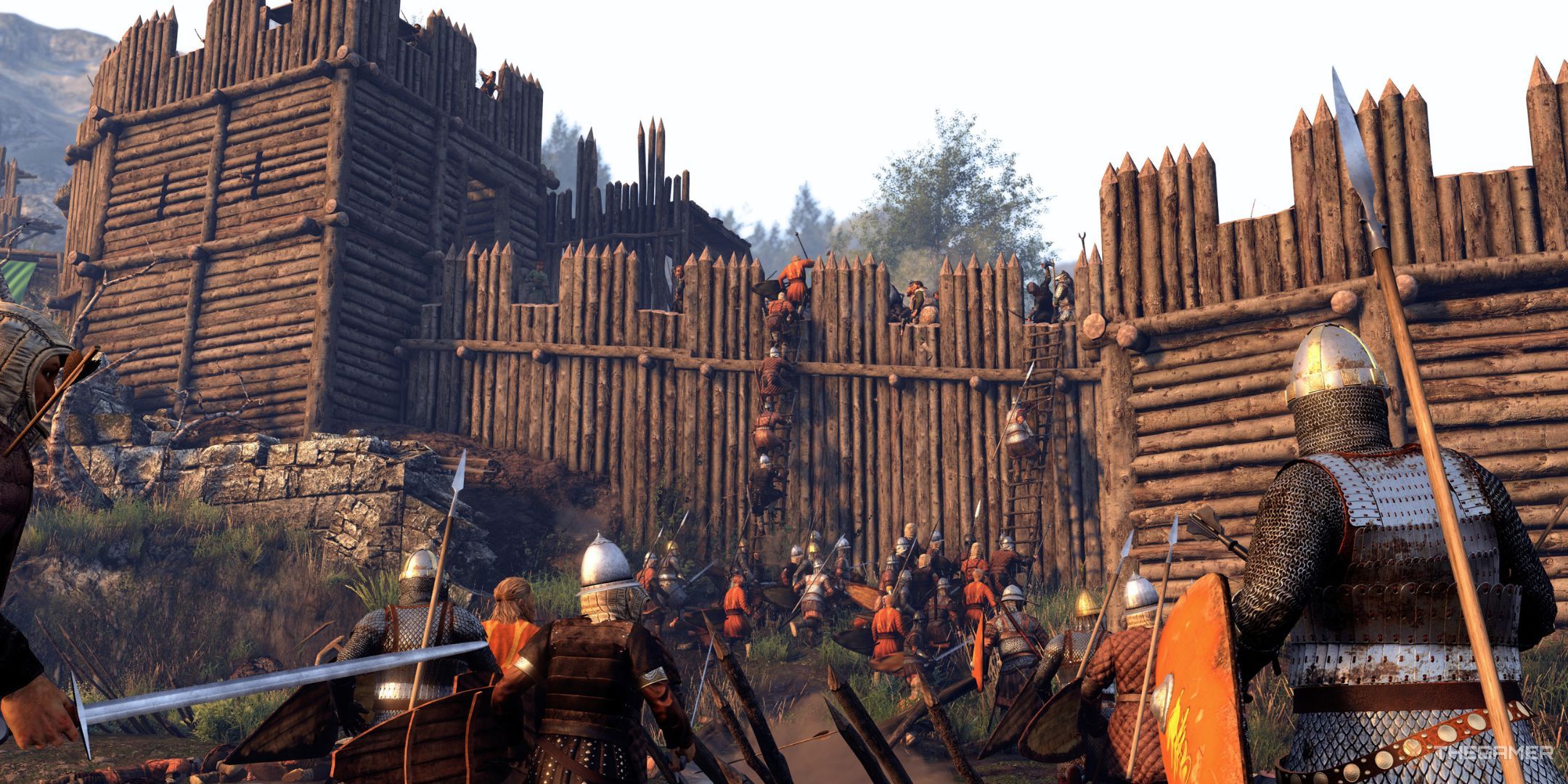 Dozens of medieval troops assaulting a wooden fort.