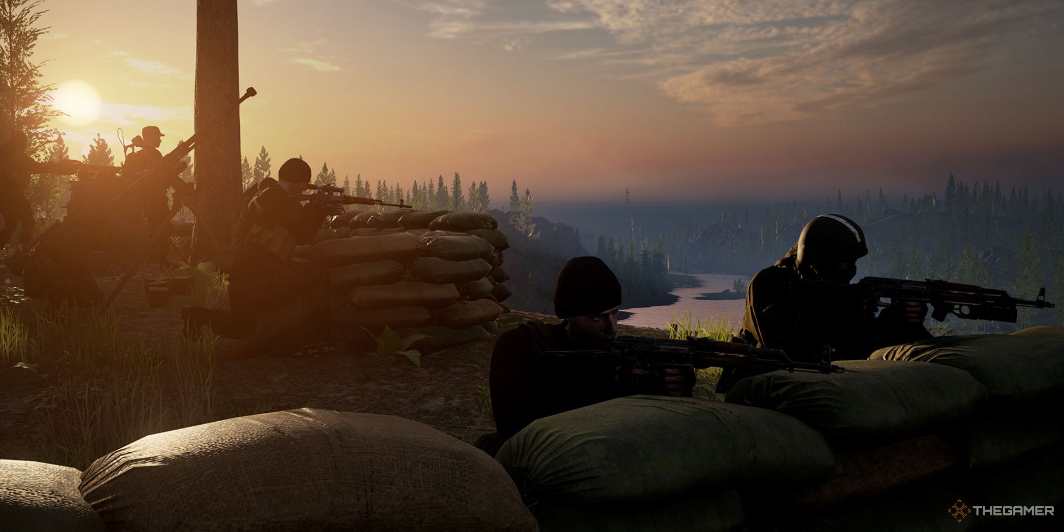 Multiple soldiers wielding rifles, crouched near sandbags on a hill.