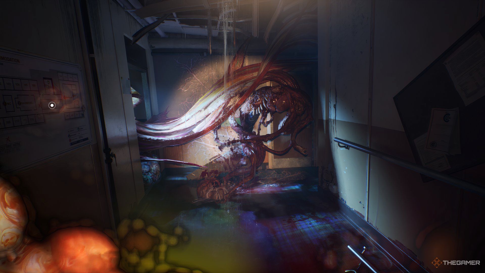 Dead body that looks like it's been turned inside out blocking the hallway in Still Wakes The Deep.