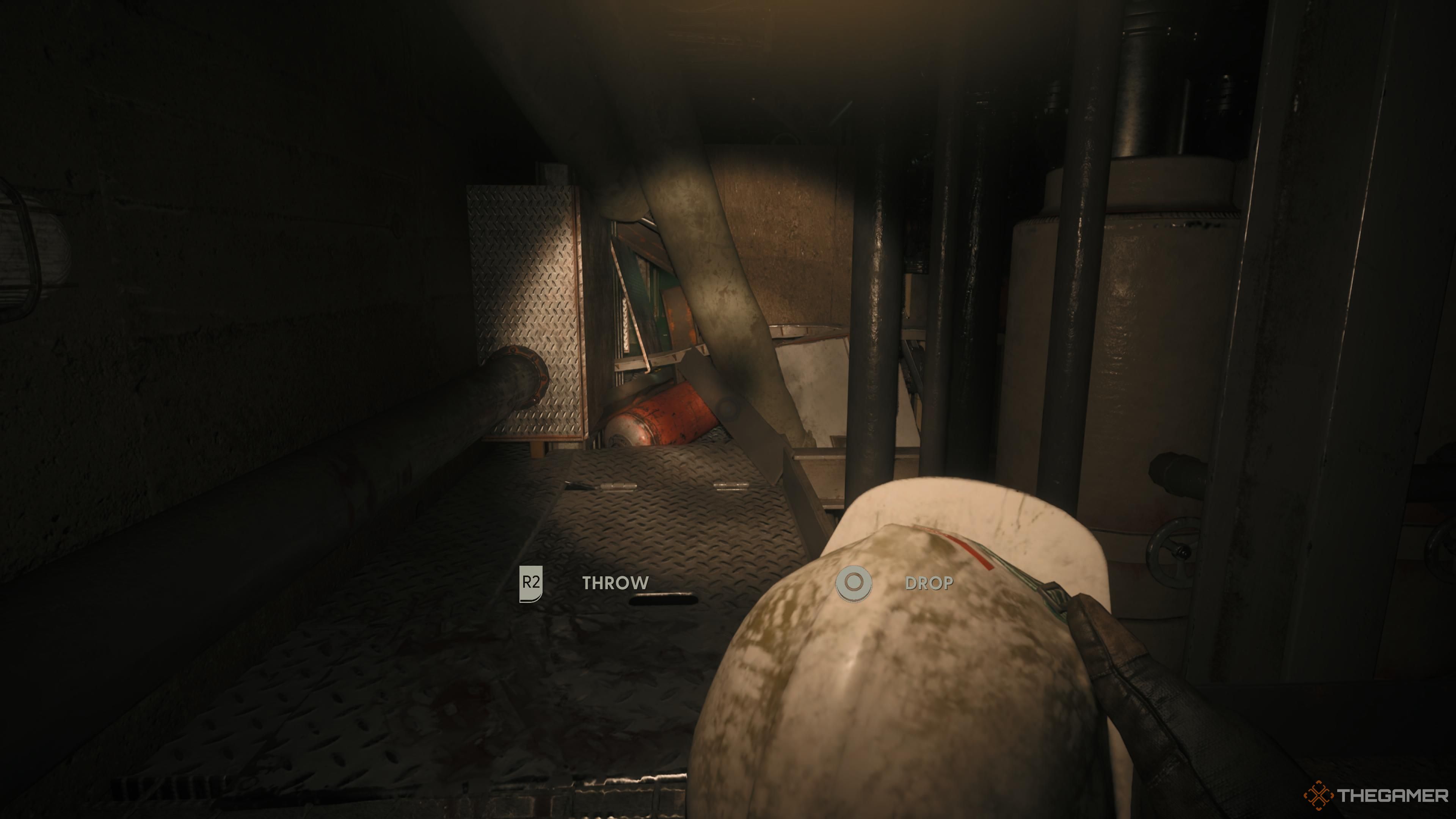 Caz holding a throwable safety helmet in Still Wakes the Deep.