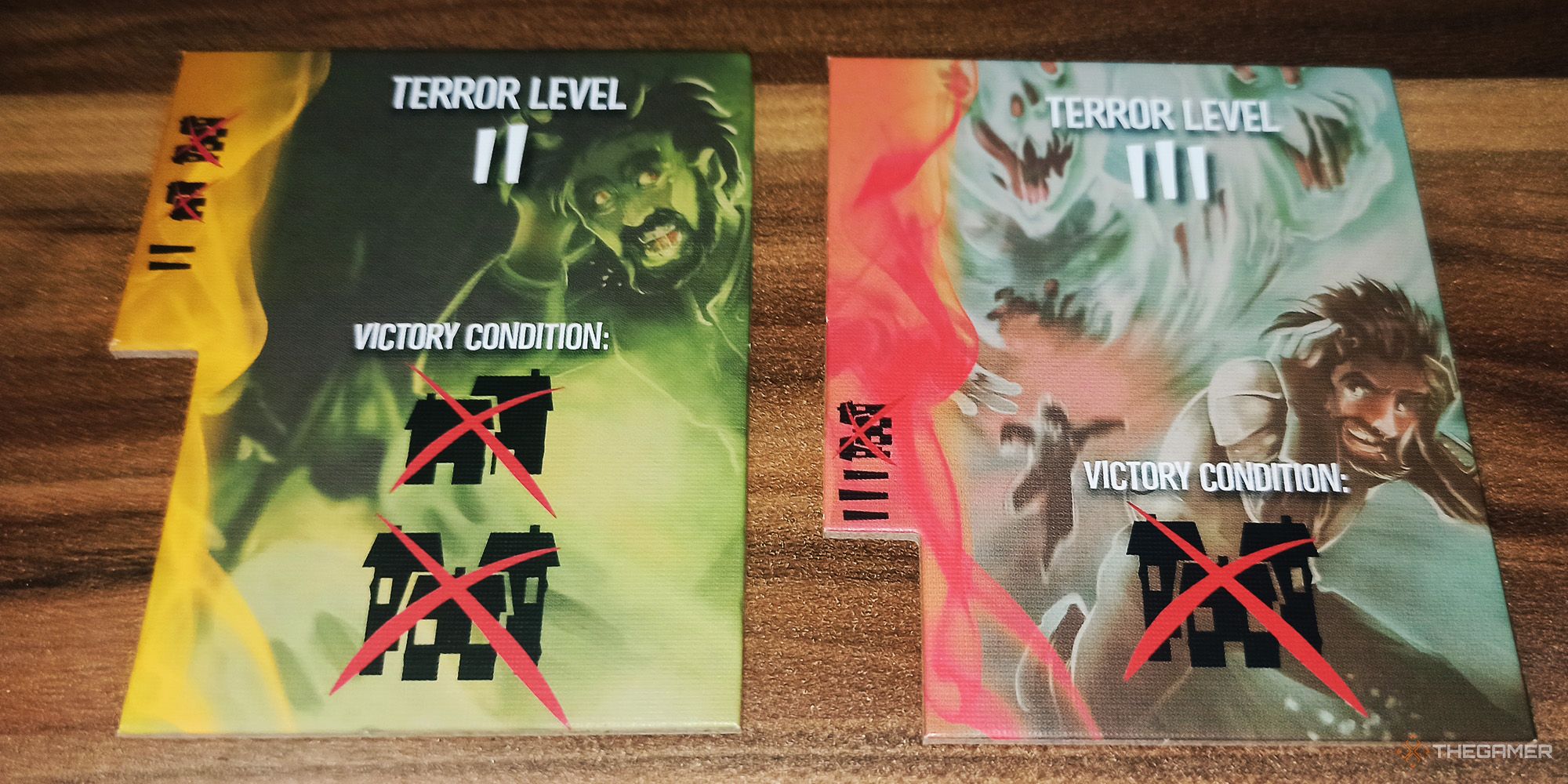 Two different Terror Level dividers are being shown in Spirit Island