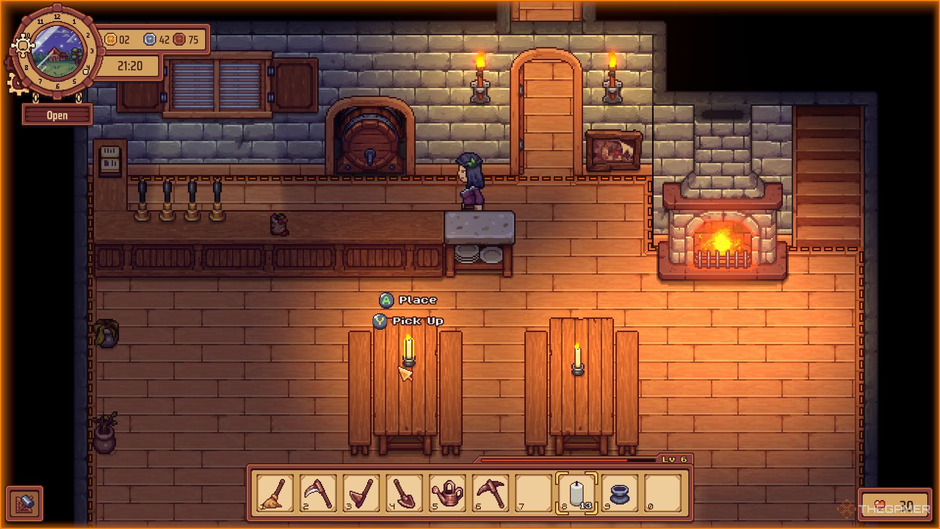The candles are being placed on the candle holders in decoration mode. 