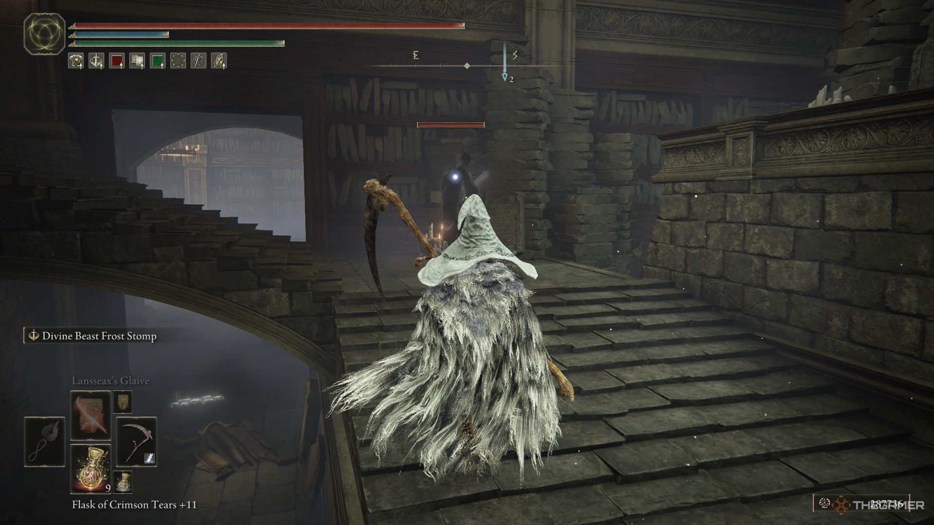Player locks onto a fire mage on the stairs in the Specimen Storehouse in Elden Ring: Shadow of the Erdtree.