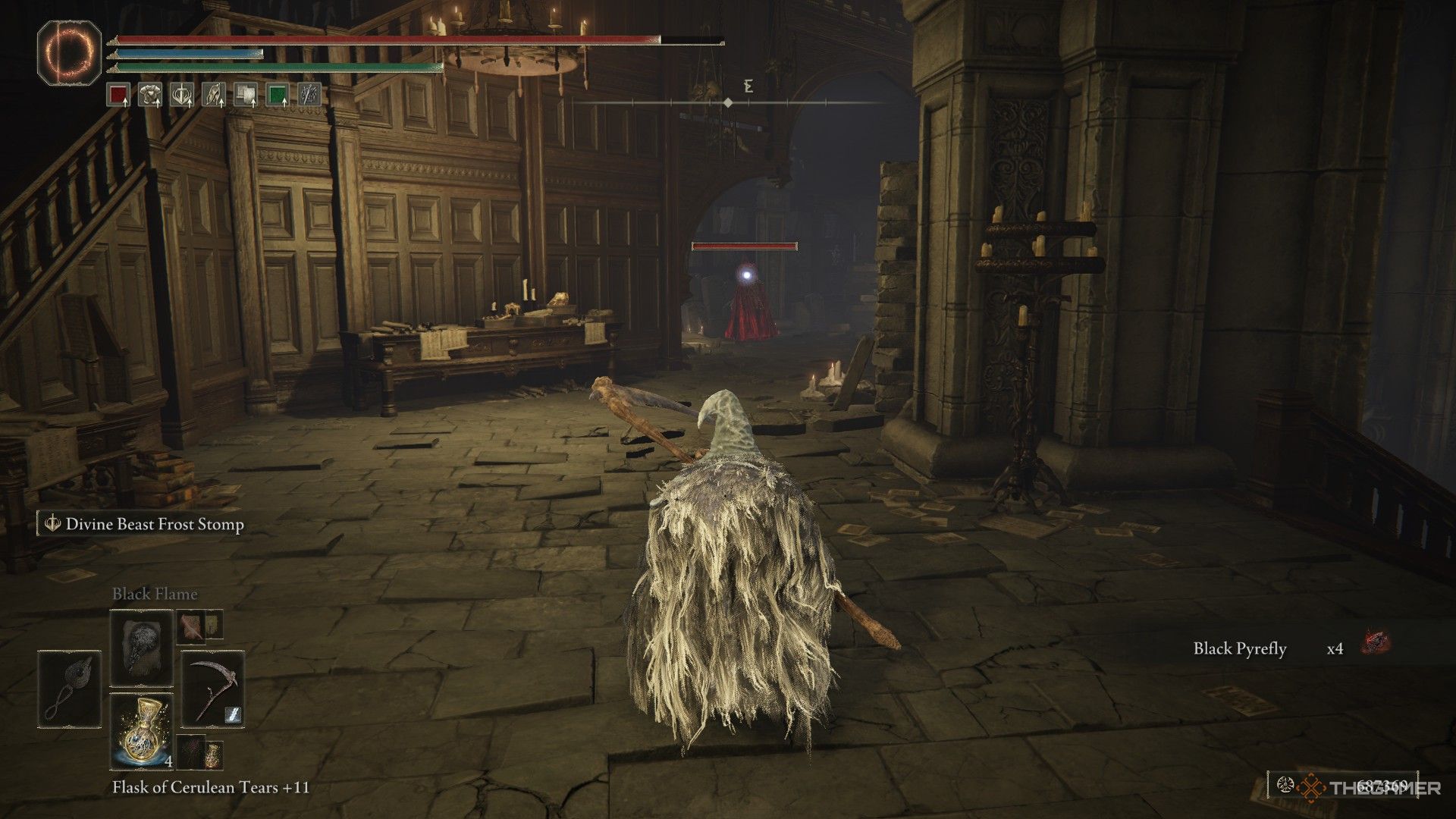 Player crouches and locks onto a Fire Knight guarding the Specimen Storehouse third floor in Elden Ring: Shadow of the Erdtree.