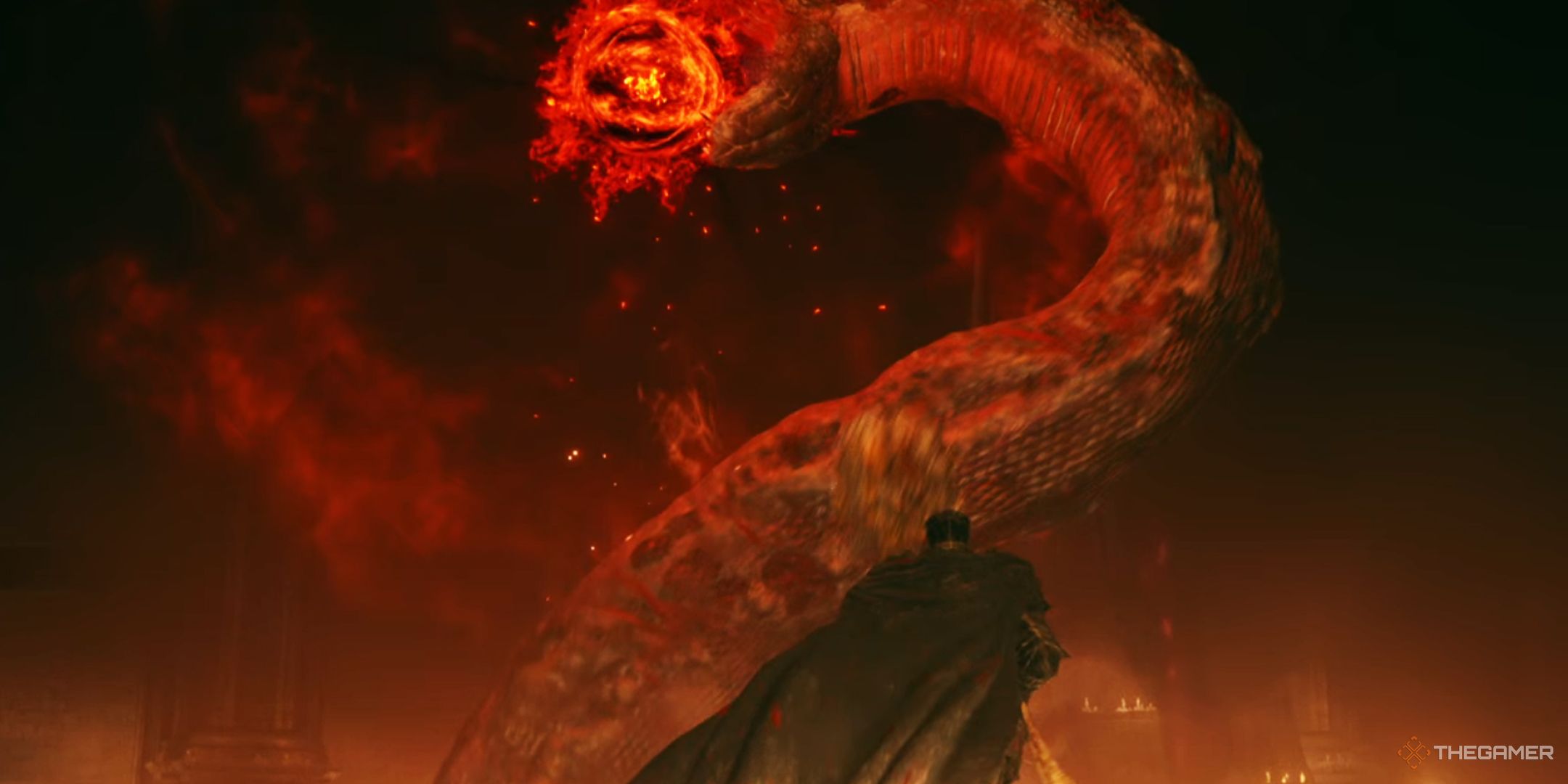 Elden Ring Tarnished looking up at giant snake Messmer form with fiery red orb in its head
