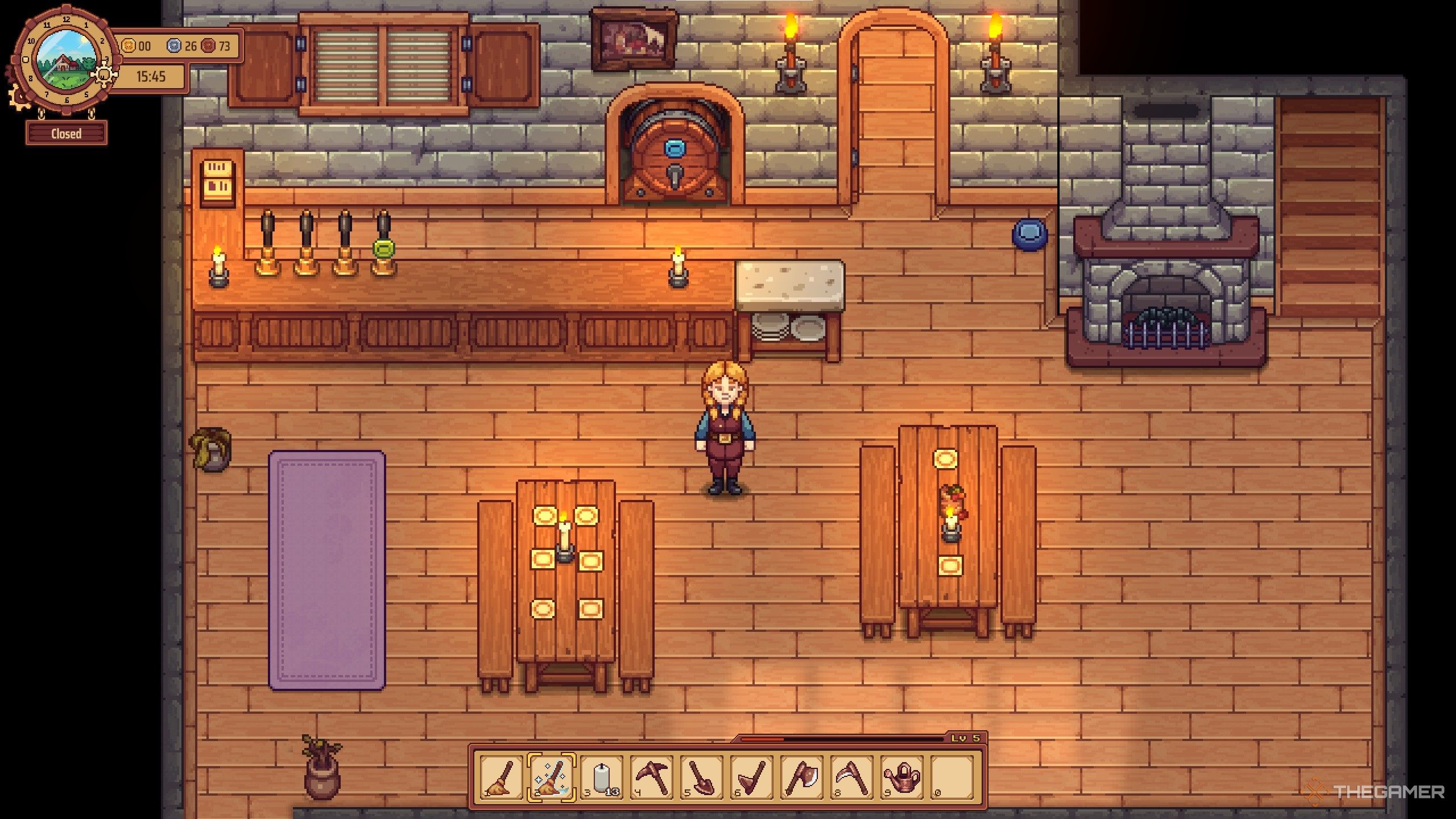 Travellers Rest avatar standing in the tavern room. A regular mop, and an icon that looks similar are both in the hotbar. The Enchanted Broom icon surrounds the broom with white sparkles so you can tell the difference from a regular mop.