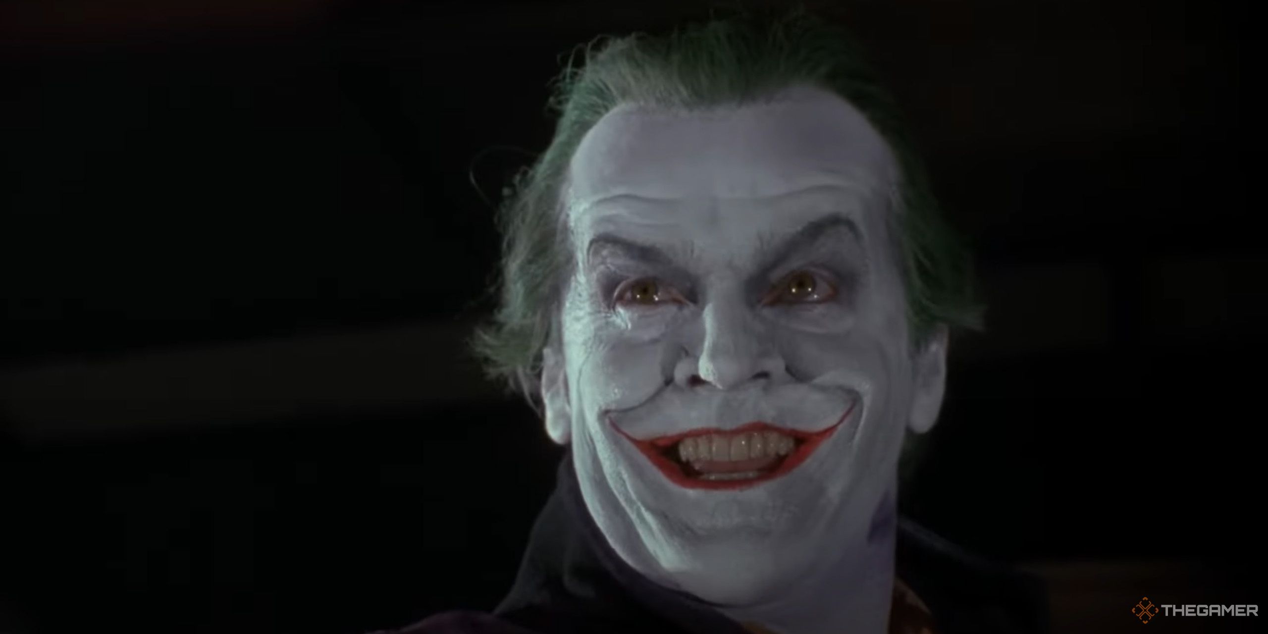 Jack Nicholson's Joker smiling in a dark room from Batman.