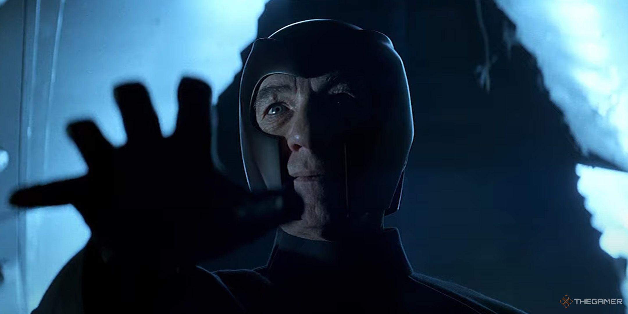 Ian McKellen's Magneto standing in a dark, ruined bus with his hand outstretched in X-Men.