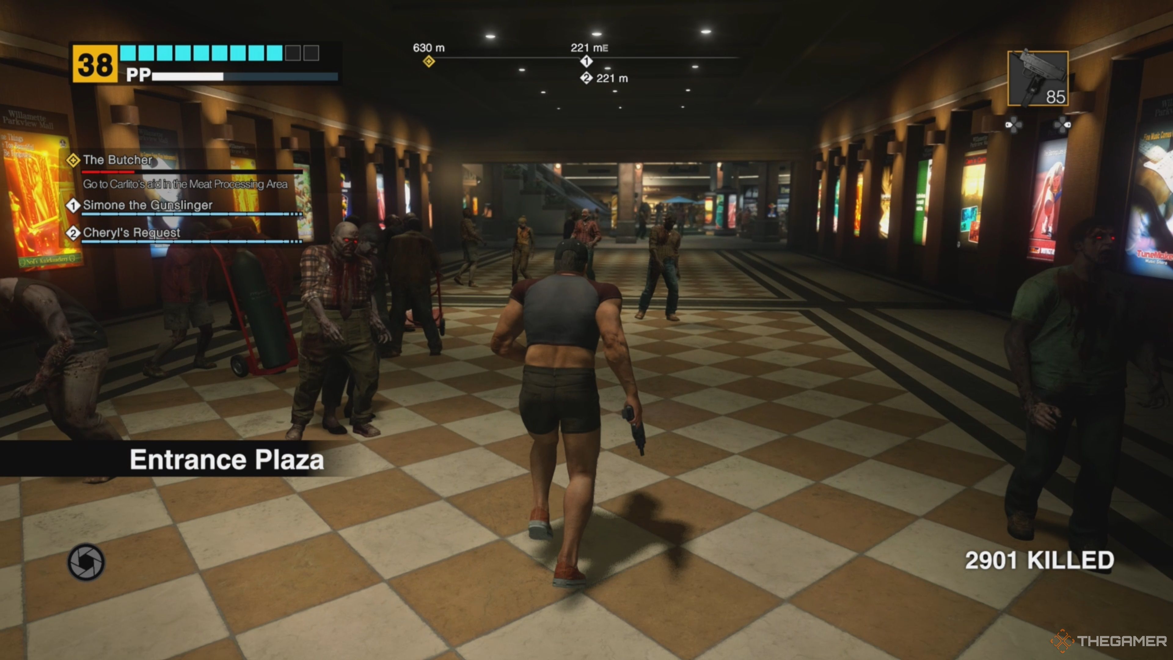 Frank West entering the Entrance Plaza and running toward a small group of zombies while wielding a Submachine Gun in Dead Rising Deluxe Remaster.