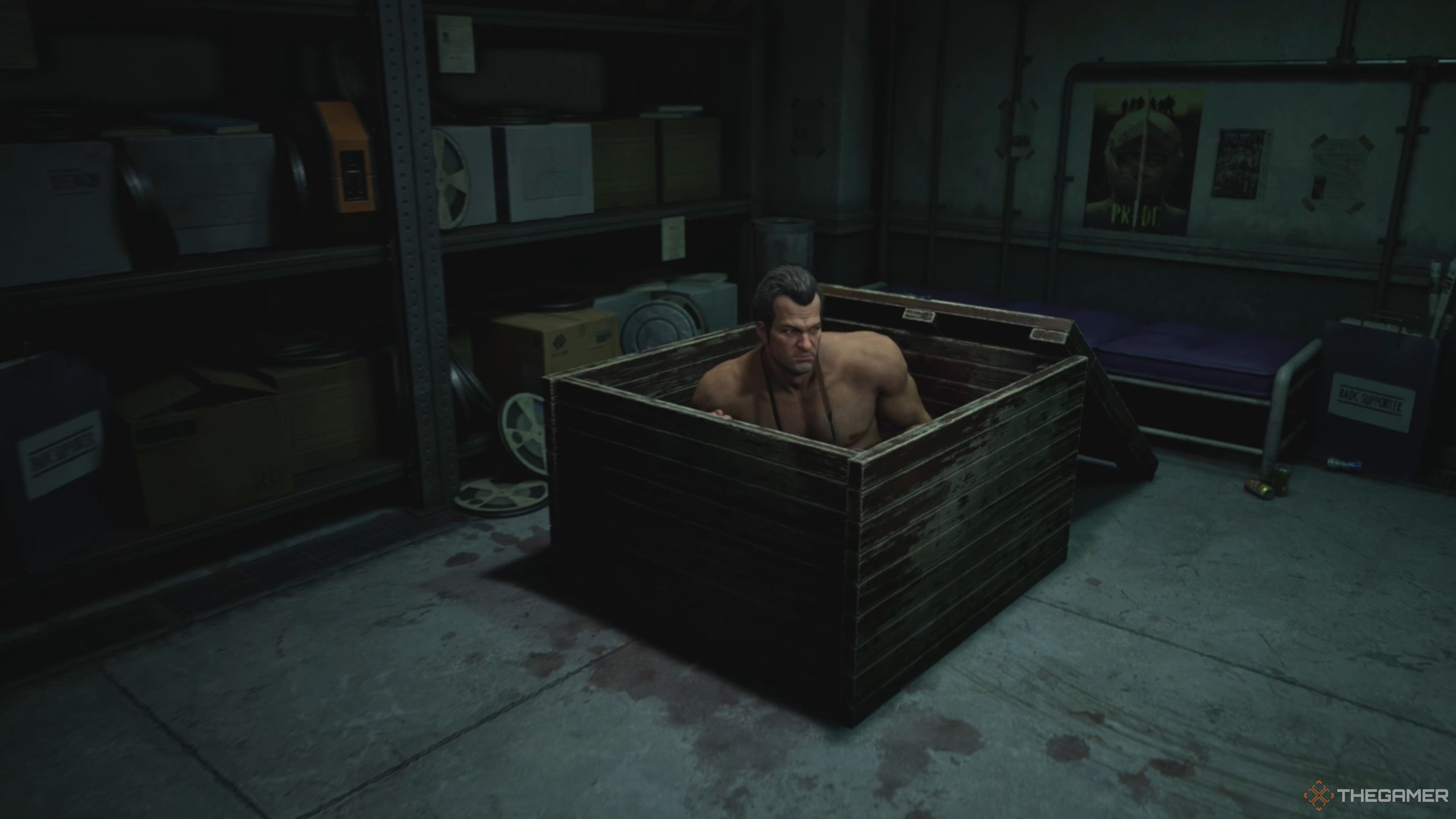 Frank West escaping a wooden crate inside of the Raincoat Cult's hidden base in Dead Rising Deluxe Remaster.
