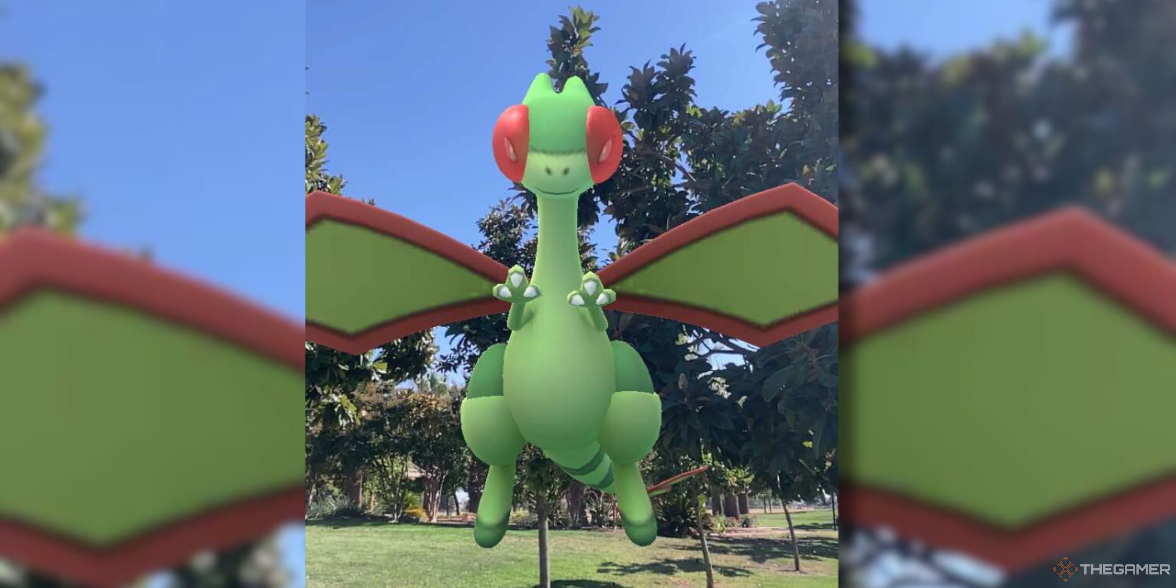 Flygon hovers in front of trees in Pokemon GO.