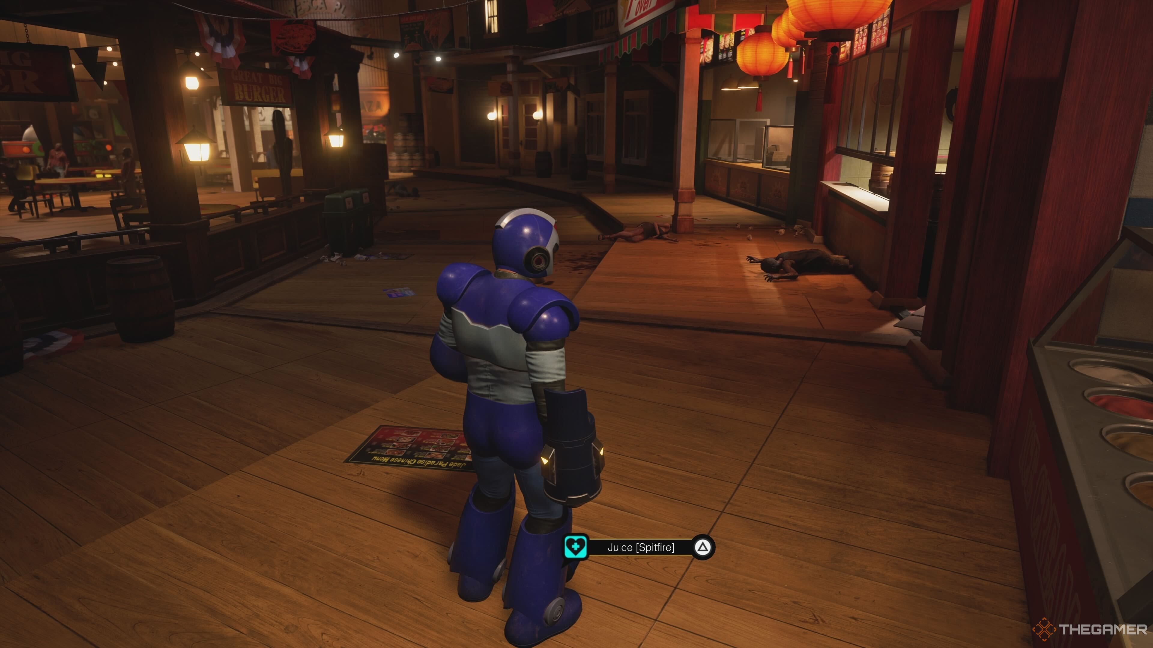 Frank West standing next to a Spitfire drink in Dead Rising Deluxe Remaster.