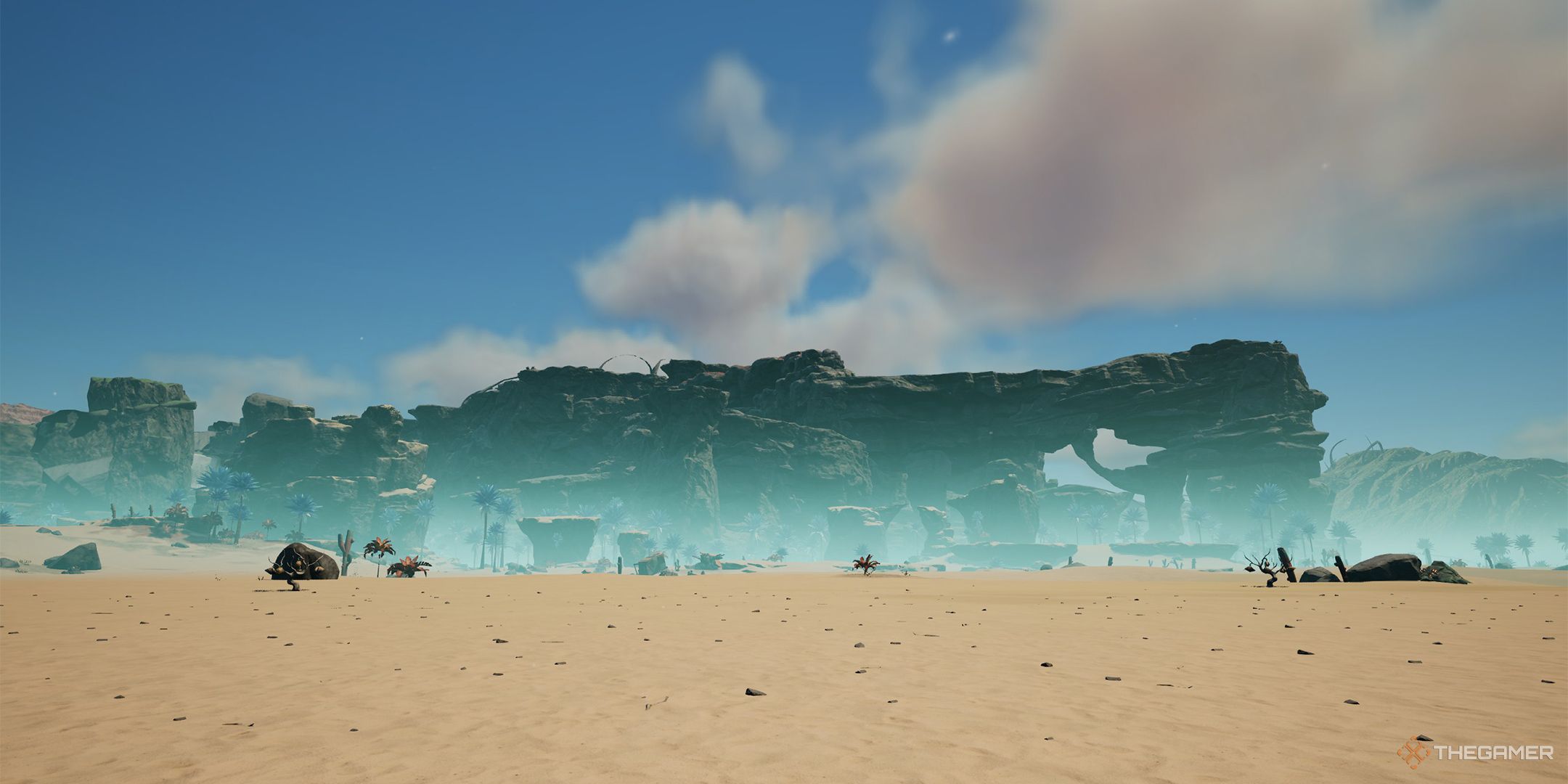The Rocky Desert starting location, featuring a wide plain of sand with large rock formations in the background.